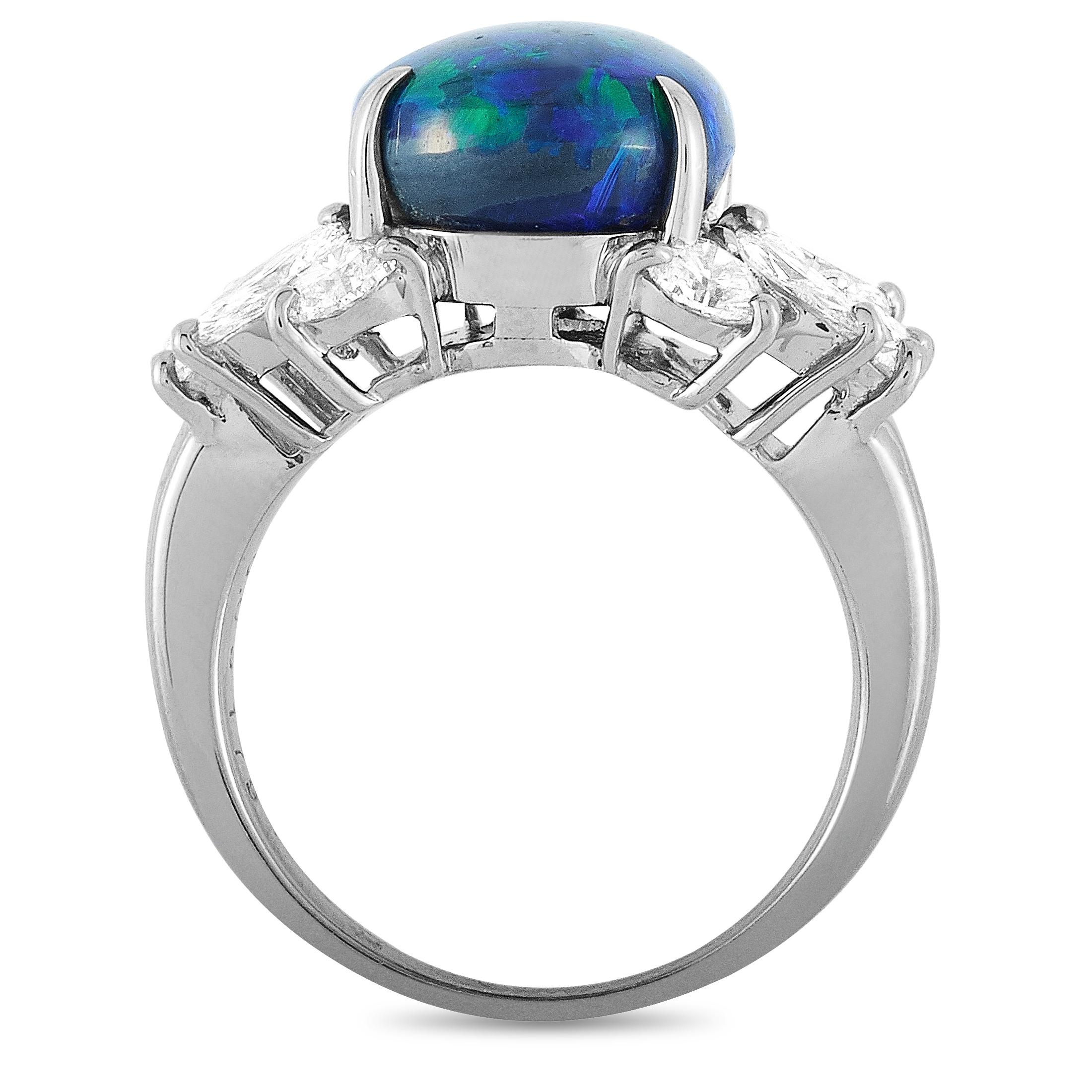 This LB Exclusive ring is crafted from platinum and weighs 10.7 grams. It boasts band thickness of 2 mm and top height of 9 mm, while top dimensions measure 22 by 13 mm. The ring is set with a black opal that weighs 6.05 carats and with diamonds