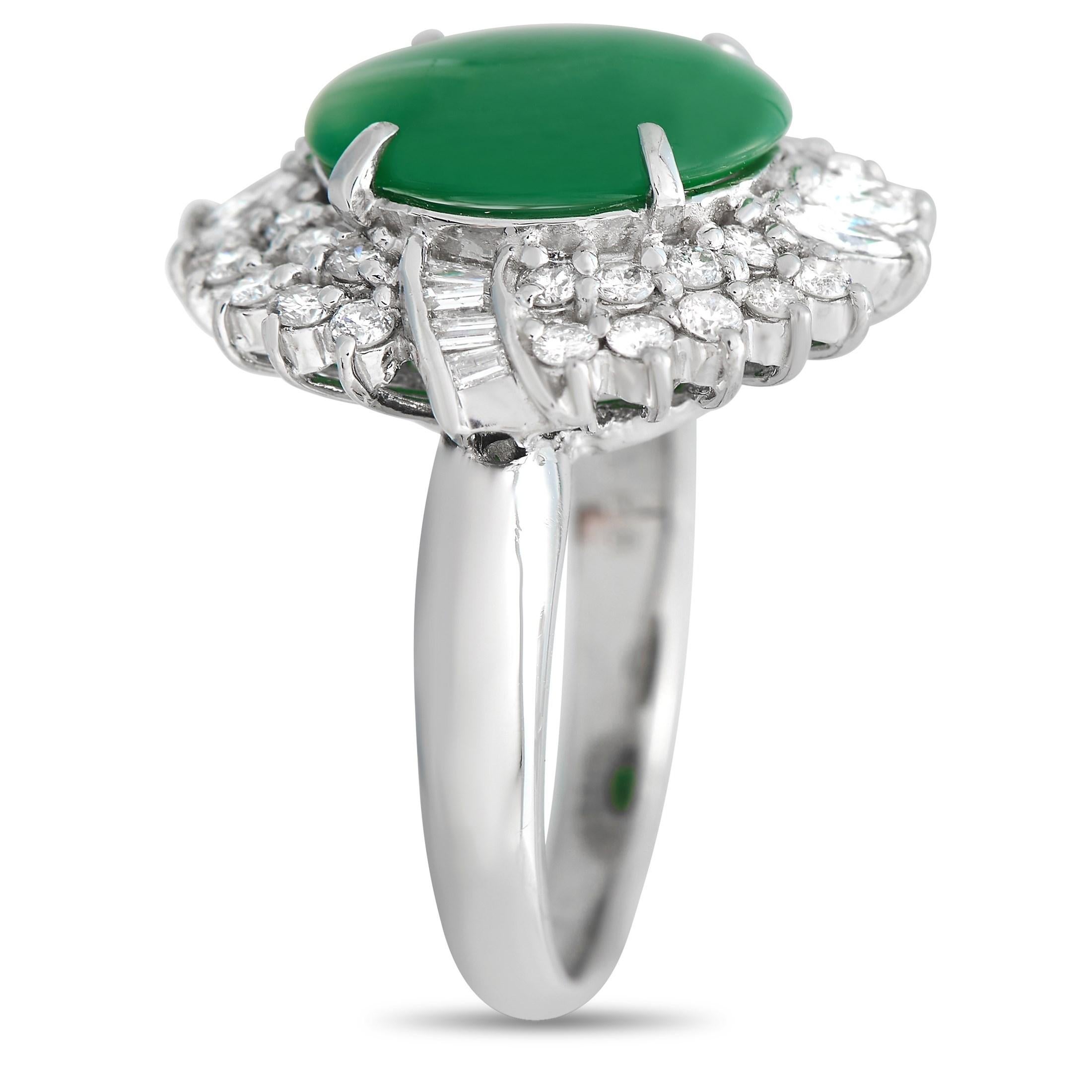 This ring will easily get anyone mesmerized. On a polished platinum band is a 3.78 carat oval jade gemstone surrounded by a double halo of round diamonds broken into quarters by two pairs of marquise diamonds and a ribbon of tapered baguette