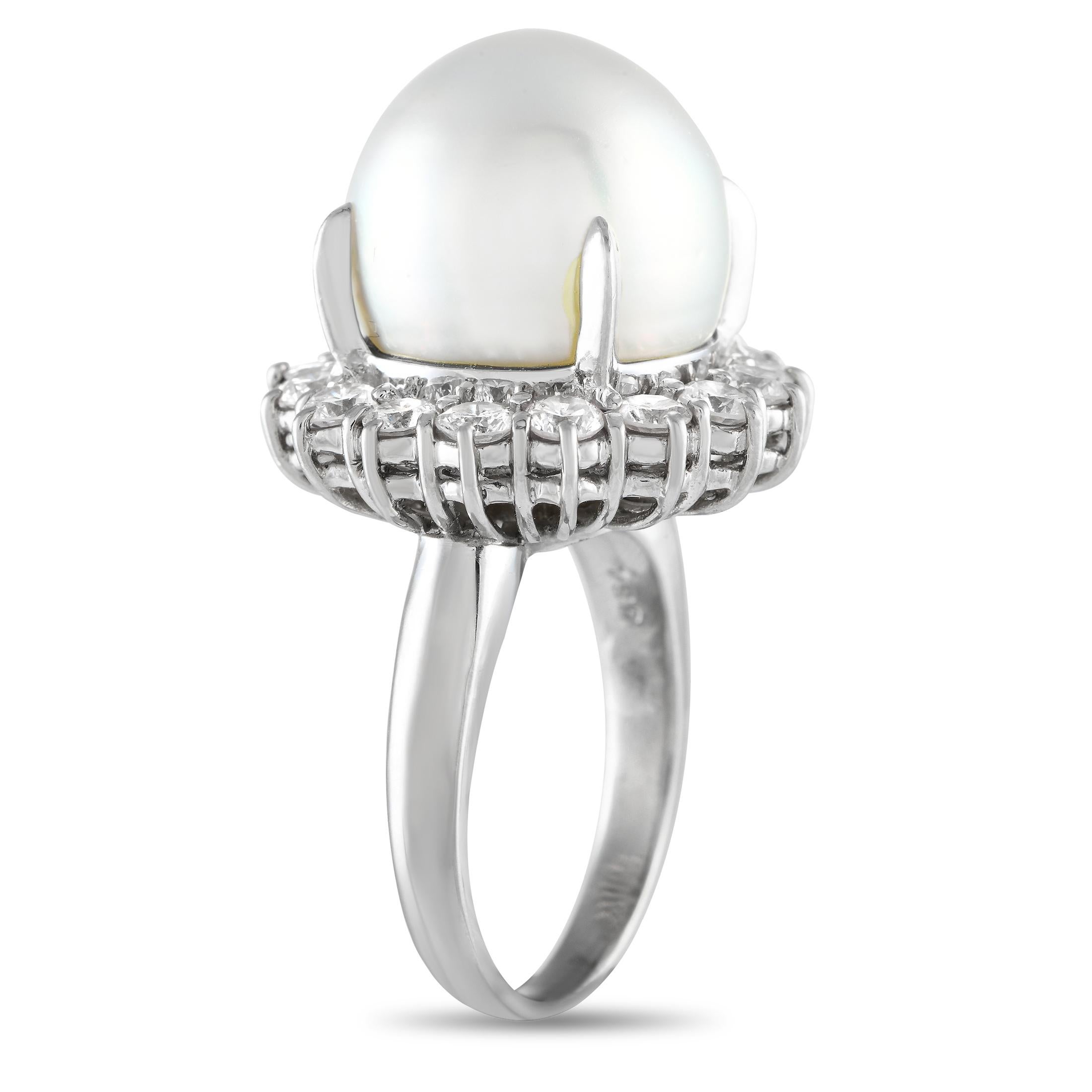 Exuding an air of understated elegance, this diamond and pearl ring will attract eyes and earn compliments. It features a slender platinum band that contrasts beautifully with the oversized centerpiece where a 15mm pearl rests on four slim prongs,