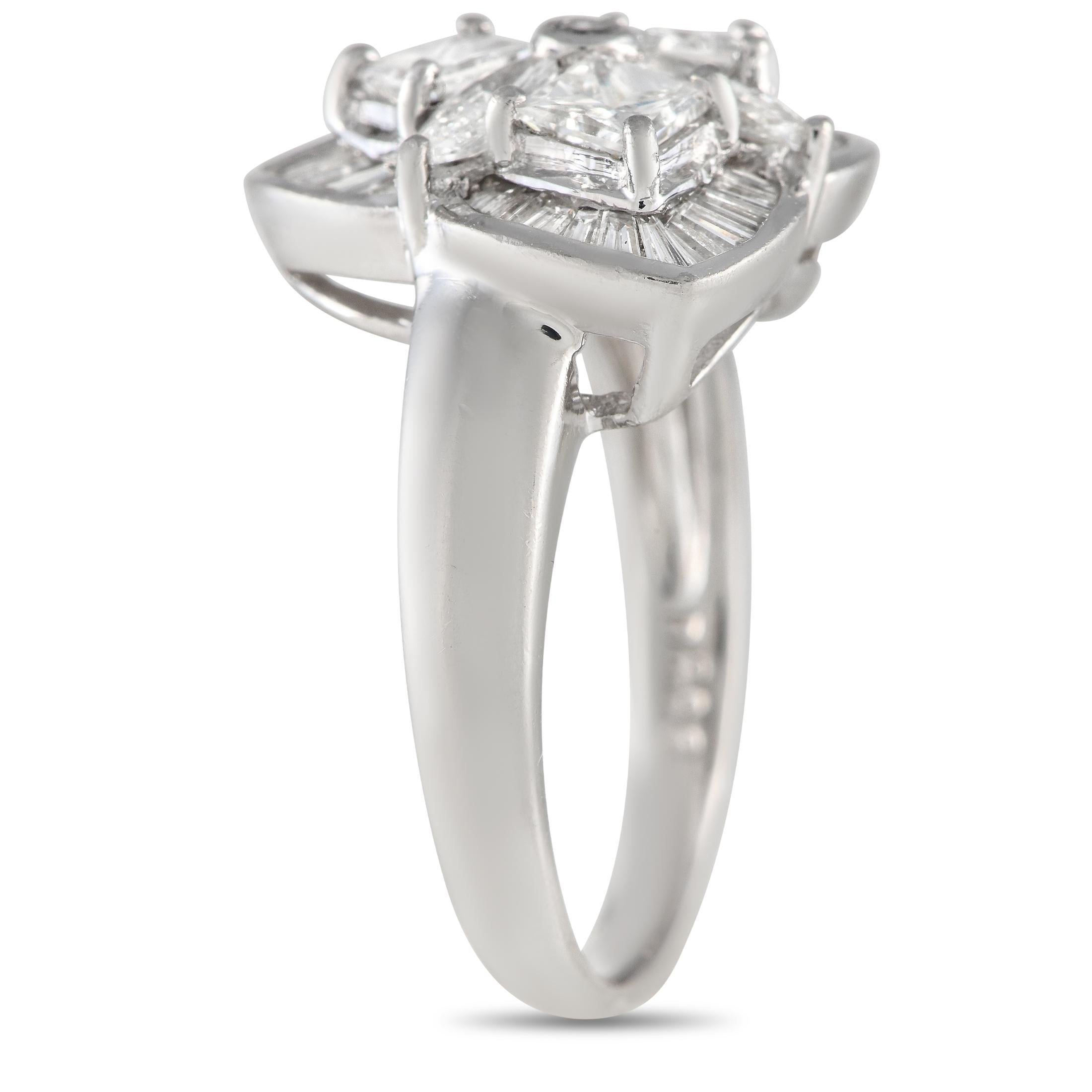 An Art Deco piece showcasing elegance in symmetry and geometry. This platinum ring features a pattern of princess-cut and marquise-cut diamonds framed by three fan-shaped channels filled with tapered baguette-cut diamonds. The ring's top dimensions