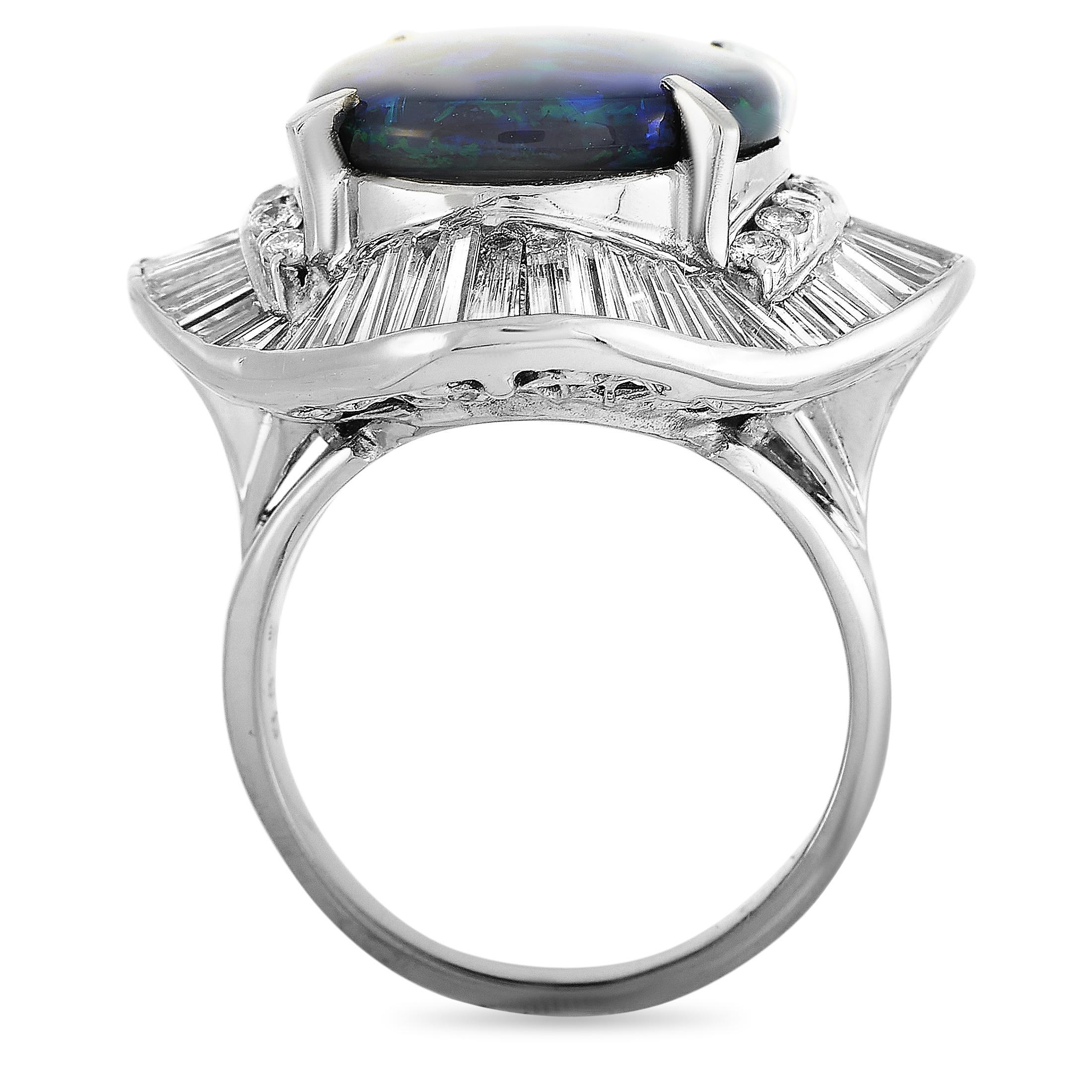 This LB Exclusive ring is made of platinum and set with a 5.93 ct opal and a total of 2.08 carats of diamonds. The ring weighs 14.1 grams and boasts band thickness of 2 mm and top height of 10 mm, while top dimensions measure 28 by 25 mm.
 
 Offered