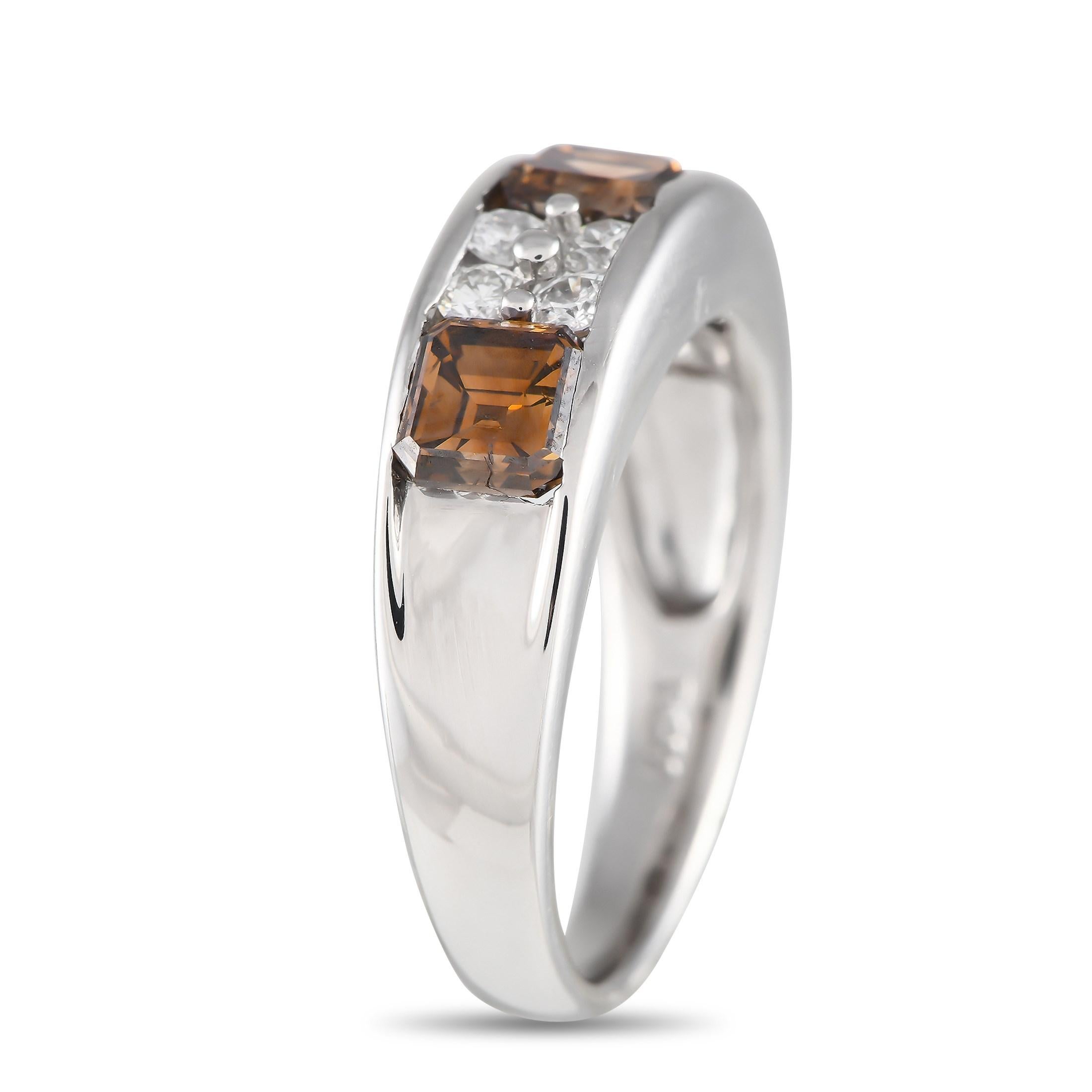 This sophisticated band ring will never go out of style. Crafted from shimmering platinum, the center of the design comes to life thanks to 2.29 carats of cognac diamonds and additional white diamond accents totaling 0.40 carats. It features a 3mm