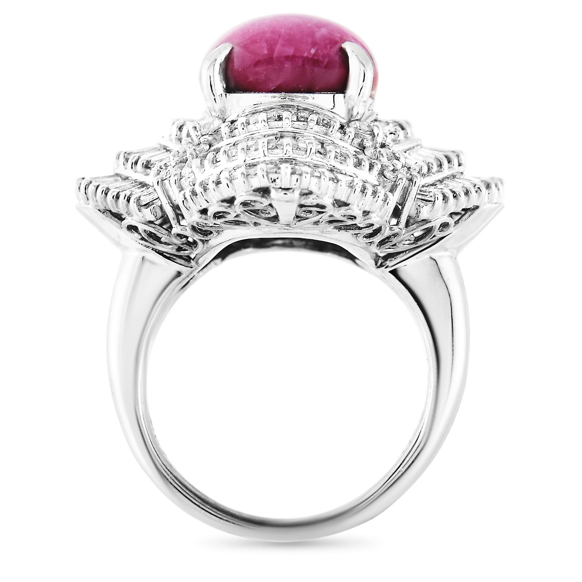 This LB Exclusive ring is made of platinum and embellished with a 12.32 ct ruby and a total of 4.10 carats of diamonds. The ring weighs 20.9 grams and boasts band thickness of 2.5 mm and top height of 14 mm, while top dimensions measure 23 by 27