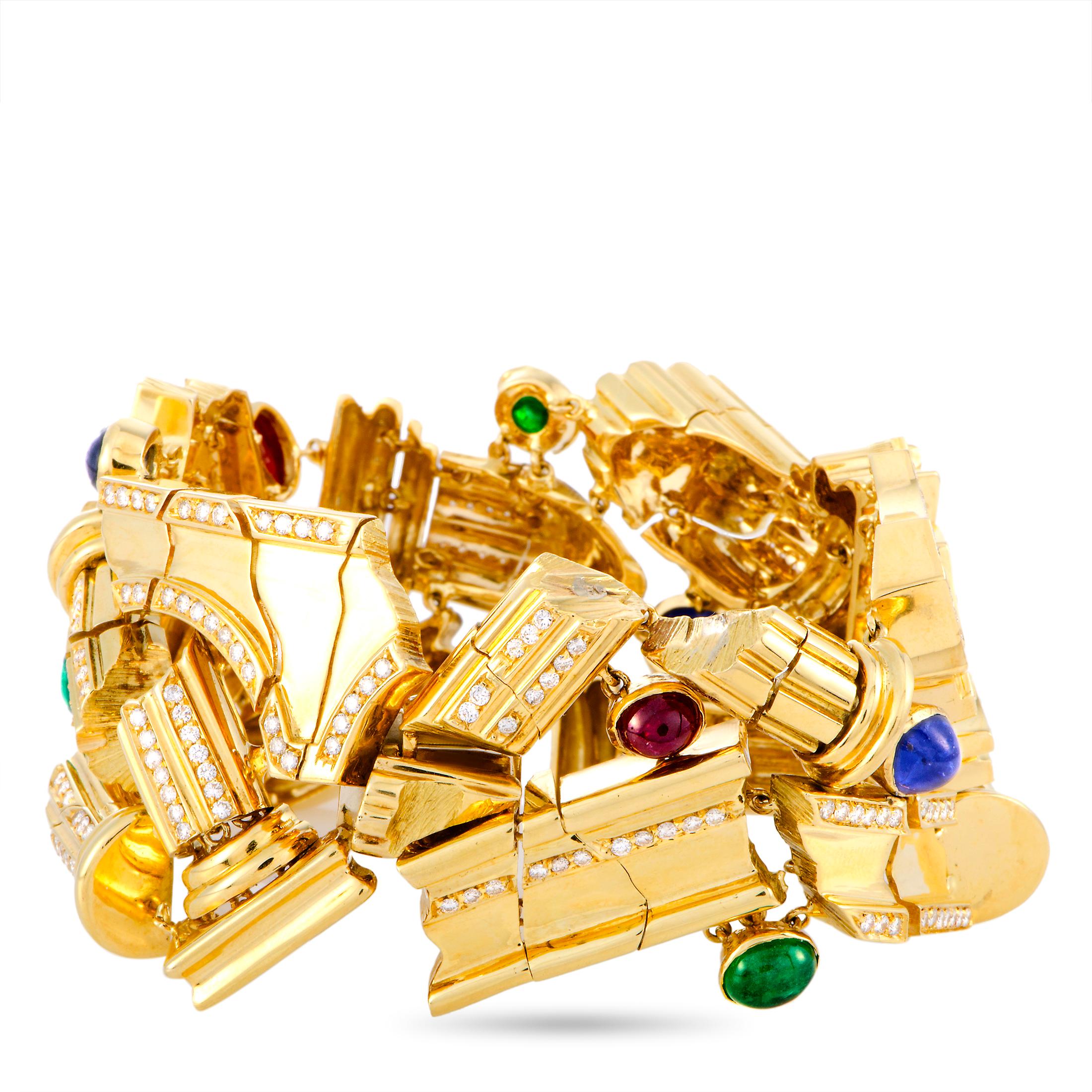 This LB Exclusive bracelet is crafted from 18K yellow gold and weighs 158.6 grams, measuring 8” in length. The bracelet is decorated with a total of 3.20 carats of diamonds, 2.90 carats of emeralds, 4.50 carats of sapphires, and 3.80 carats of