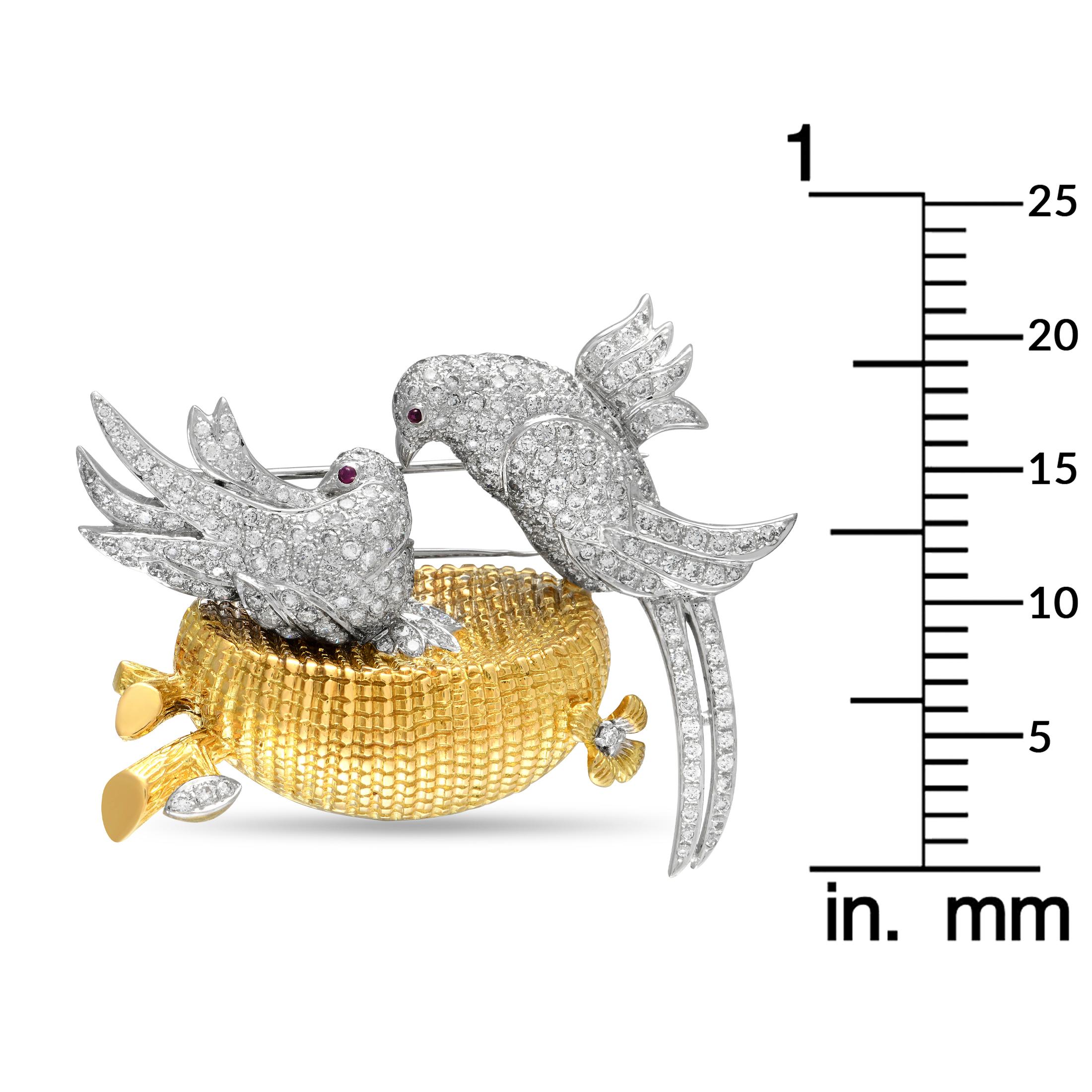 Here is an LB Exclusive brooch perfect for when you need to add a hint of glamour or a statement-making finish to an outfit. It measures 2.15 by 1.80 inches and features a textured yellow gold bird nest with two white gold birds fully covered with