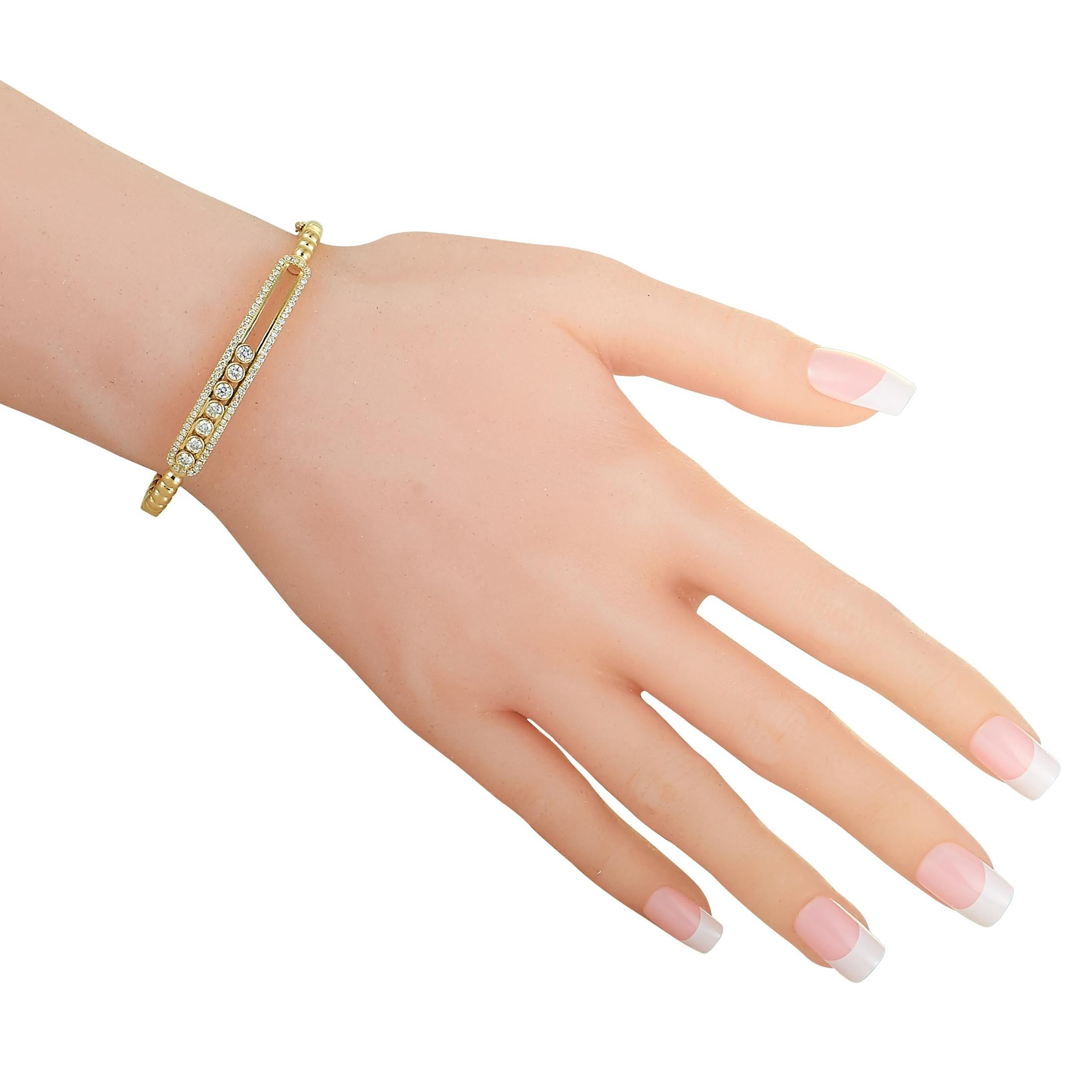 This LB Exclusive bangle bracelet is made out of 18K yellow gold and diamonds that total 1.20 carats. The bracelet weighs 13.8 grams and measures 7” in length.

Offered in brand new condition, this item includes a gift box.