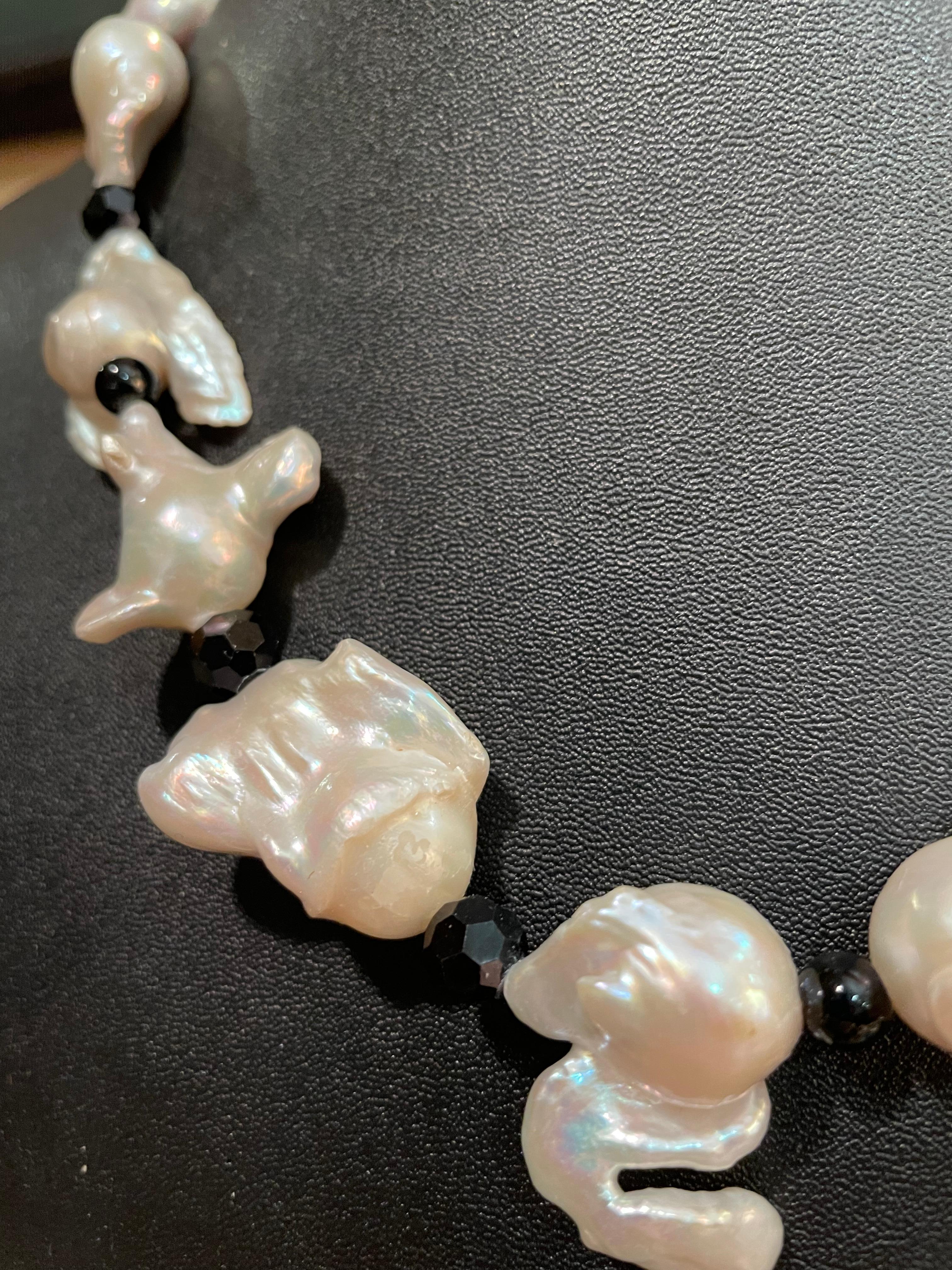Lorraine’s Bijoux has on offer a Large White Baroque Pearl and vintage black crystal, handmade, one of a king necklace.
These pearls are wonderfully asymmetrical and make a strong but refined statement.
The vintage crystals are faceted Czech crystal