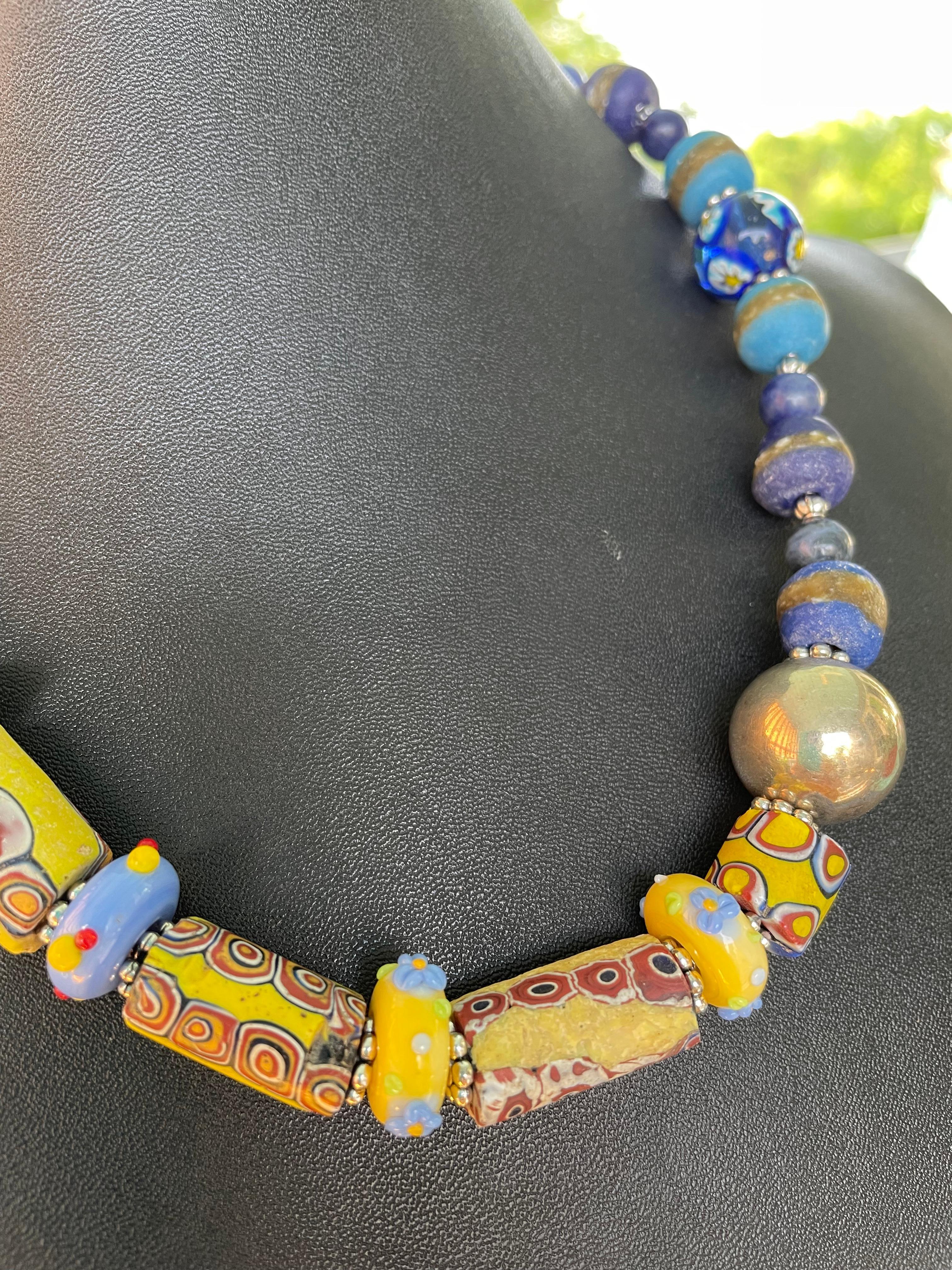 Lorraine’s Bijoux offers a beaded necklace of Early 20th century handmade Venetian glass tubular beads. Each of these handmade and hand cut beads is unique unto itself. Contemporary handmade glass rondelles are spacers and carry out the yummy color