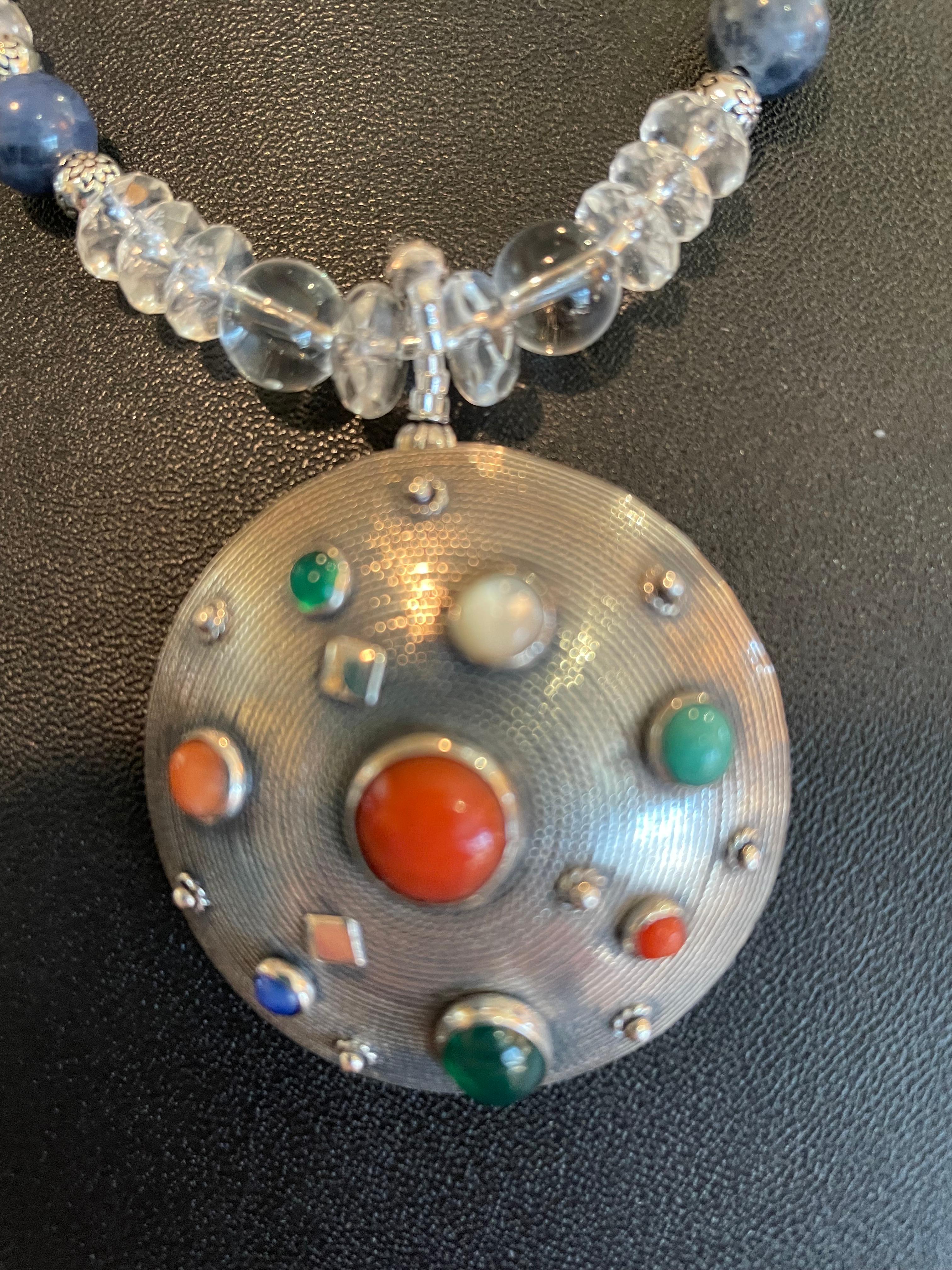 Lorraine’s Bijoux offers a Unique Vintage 70’s Modern Sterling Silver Pendant Necklace. This stunning piece is encrusted with semi precious, cabochon stones in Sterling Silver settings. This piece is Italian made so  the craftsmanship is impeccable