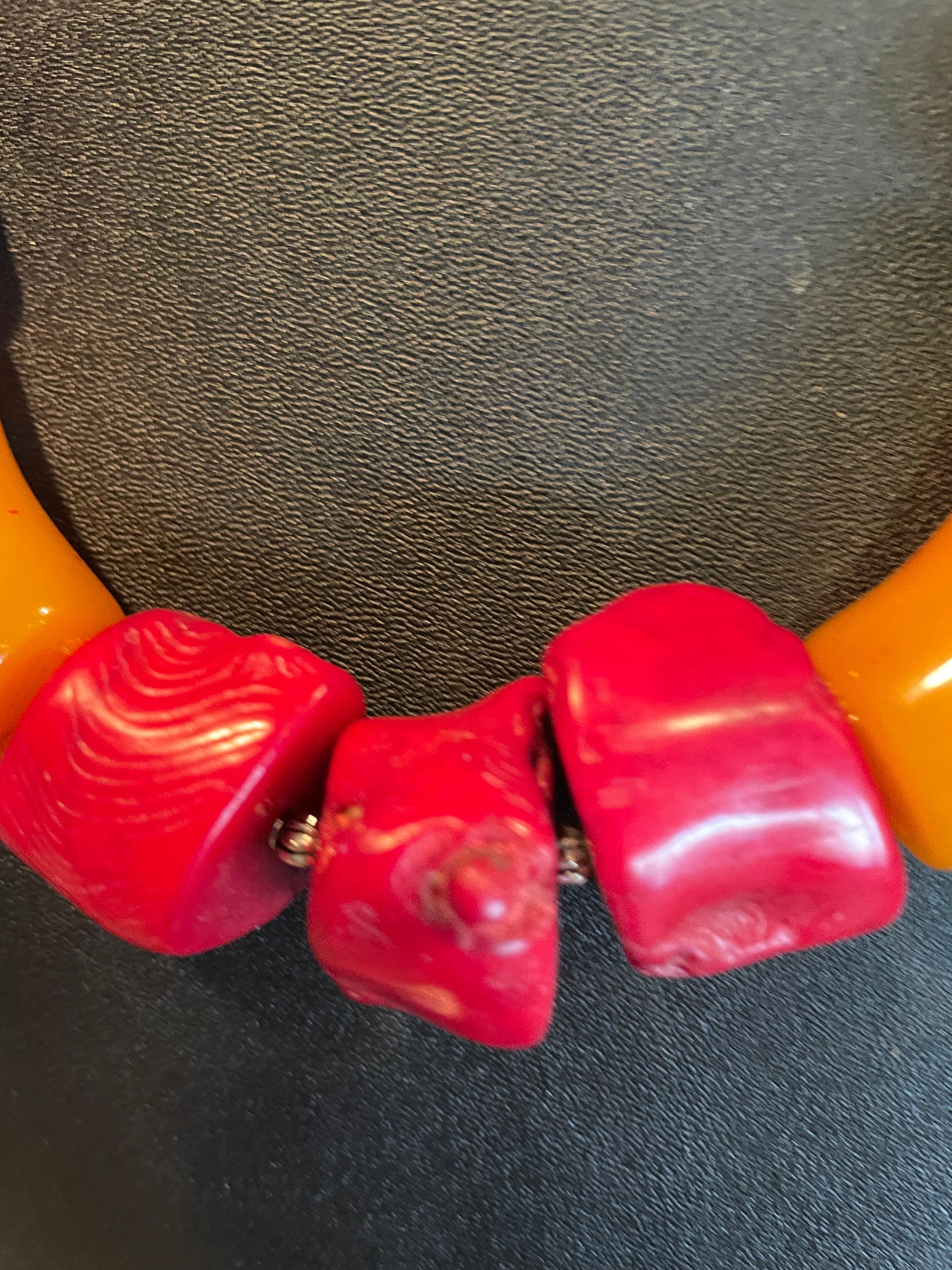 Lorraine’s Bijoux offers  Dramatic, French 80’s Bakelite and Chinese Red Coral , one of a kind, handmade necklace. Sterling Silver spacer beads and lobster clasp enhance the delicious colors. This is truly a Dramatic statement piece that will add