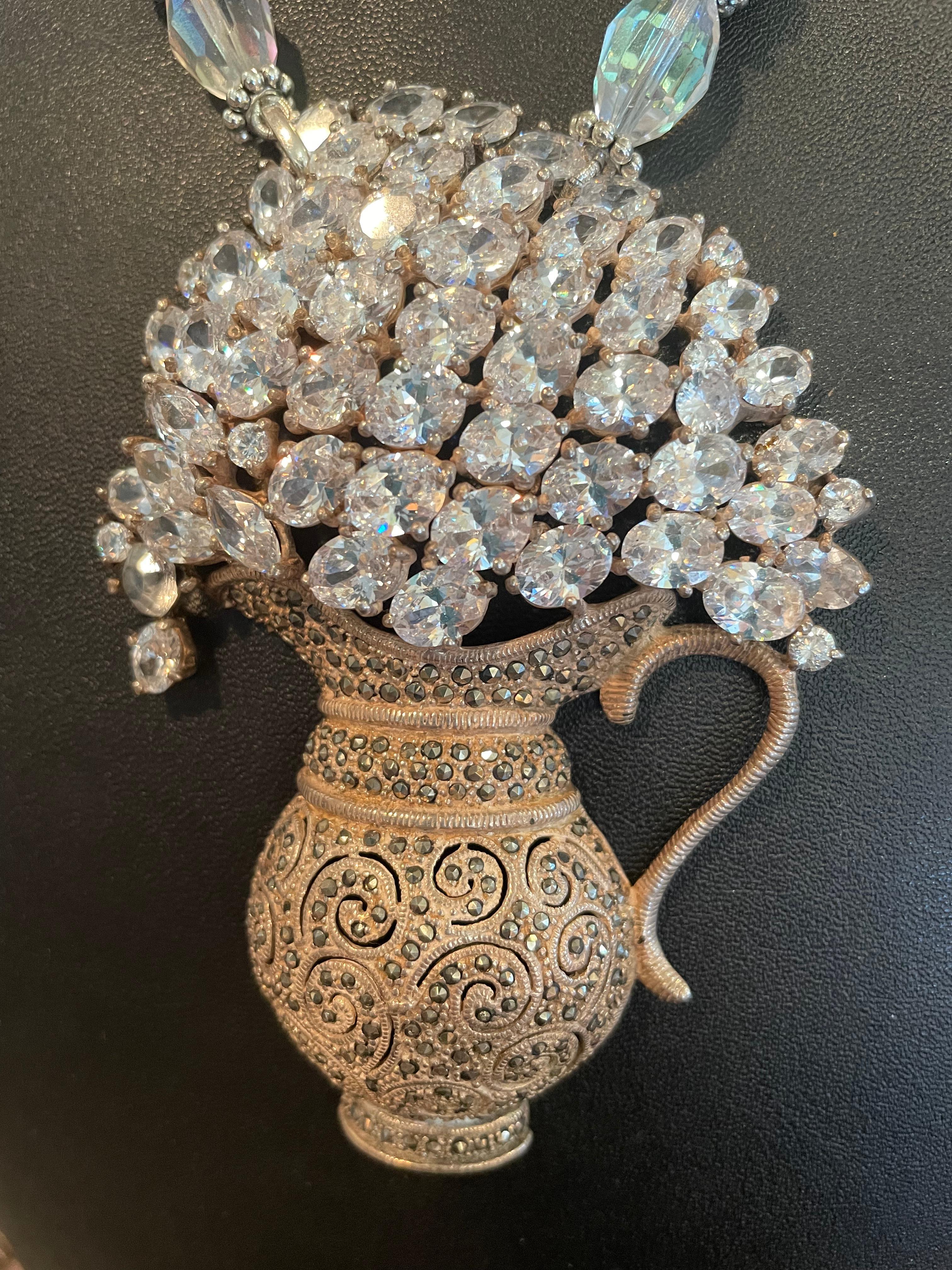 LB offers an Amazing, Stunning, Dramatic, one of a kind, handmade, original necklace. 
The centerpiece is an incredible Vintage, Sterling Silver, Marcasite, and cut crystal Urn Brooch that hang  on a strand of hand cut  Rock Crystal rondelles beads,