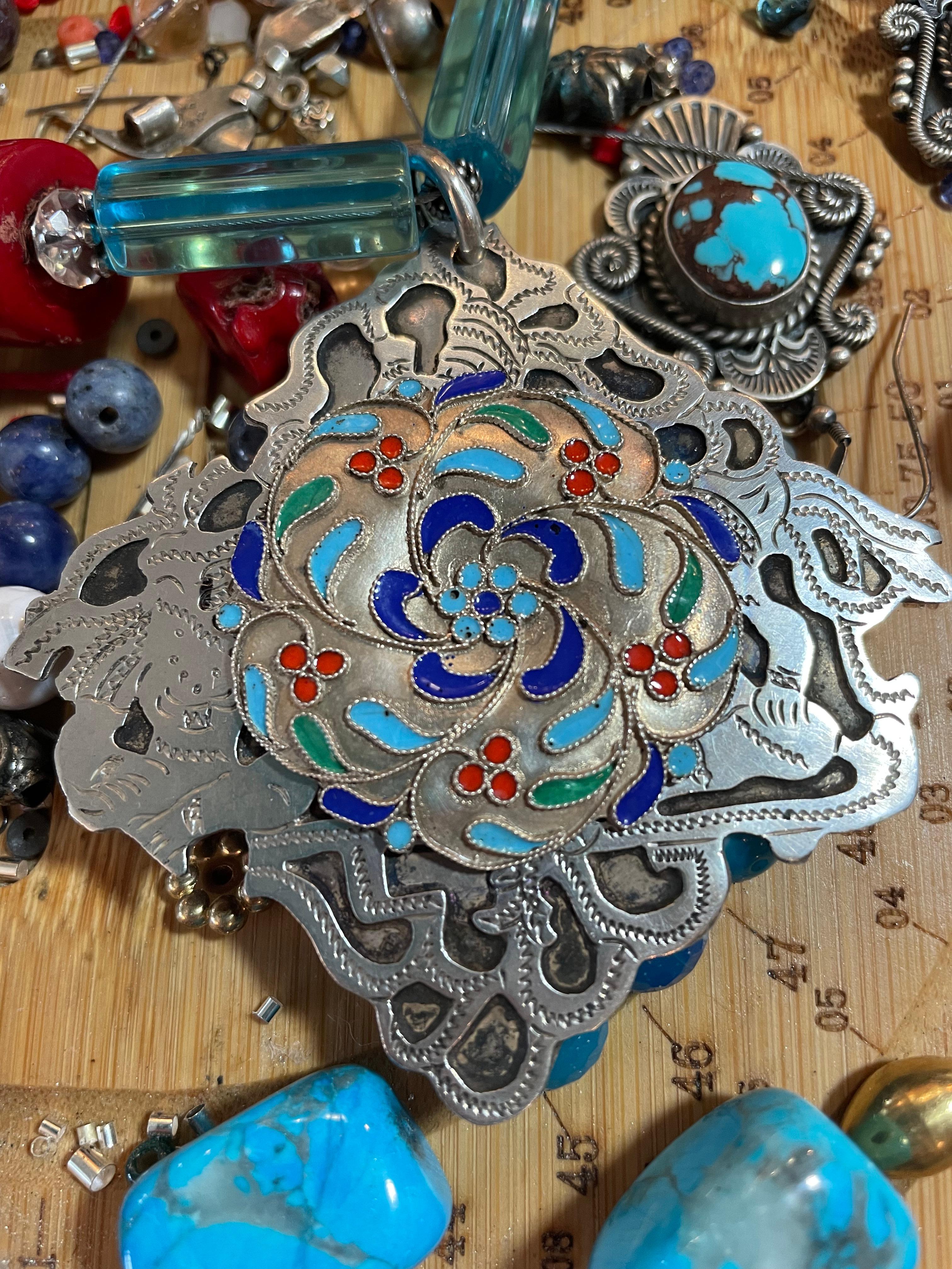 Lorraine’s Bijoux offers an Impressive, large, Vintage, Sterling Silver Mexican, and Enamel pendant Necklace. This combination of two vintage silver brooches, one with fretwork Aztec style influence, and the other with Islamic style floral enamel
