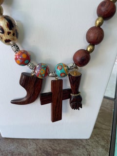 LB offers a Talisman necklace Wood glass Brass