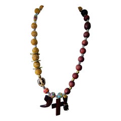 LB offers a Talisman necklace Wood glass Brass