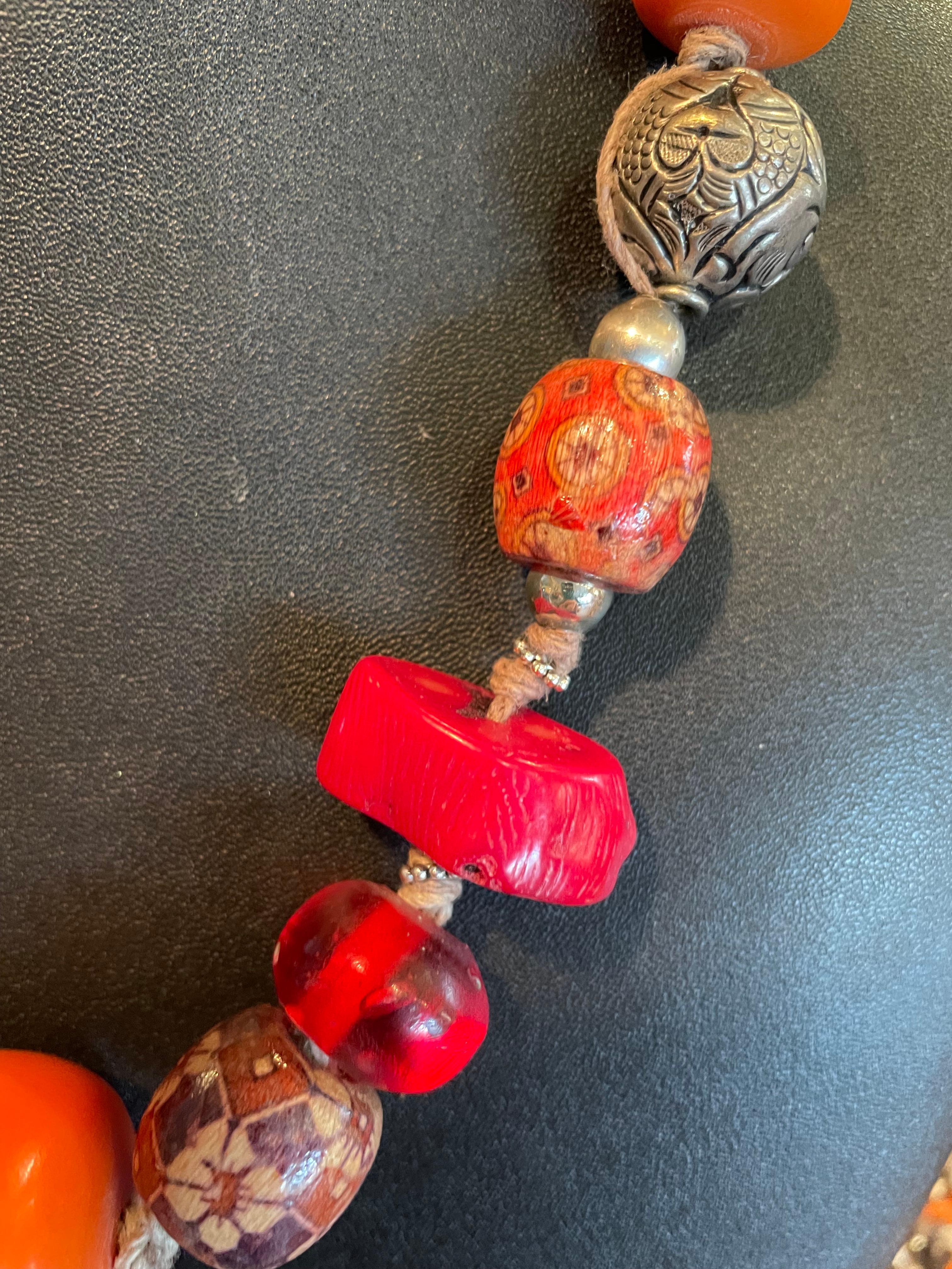 Anglo-Indian LB offers a tribal amber, coral, Tibetan silver, resin, and wood necklace For Sale