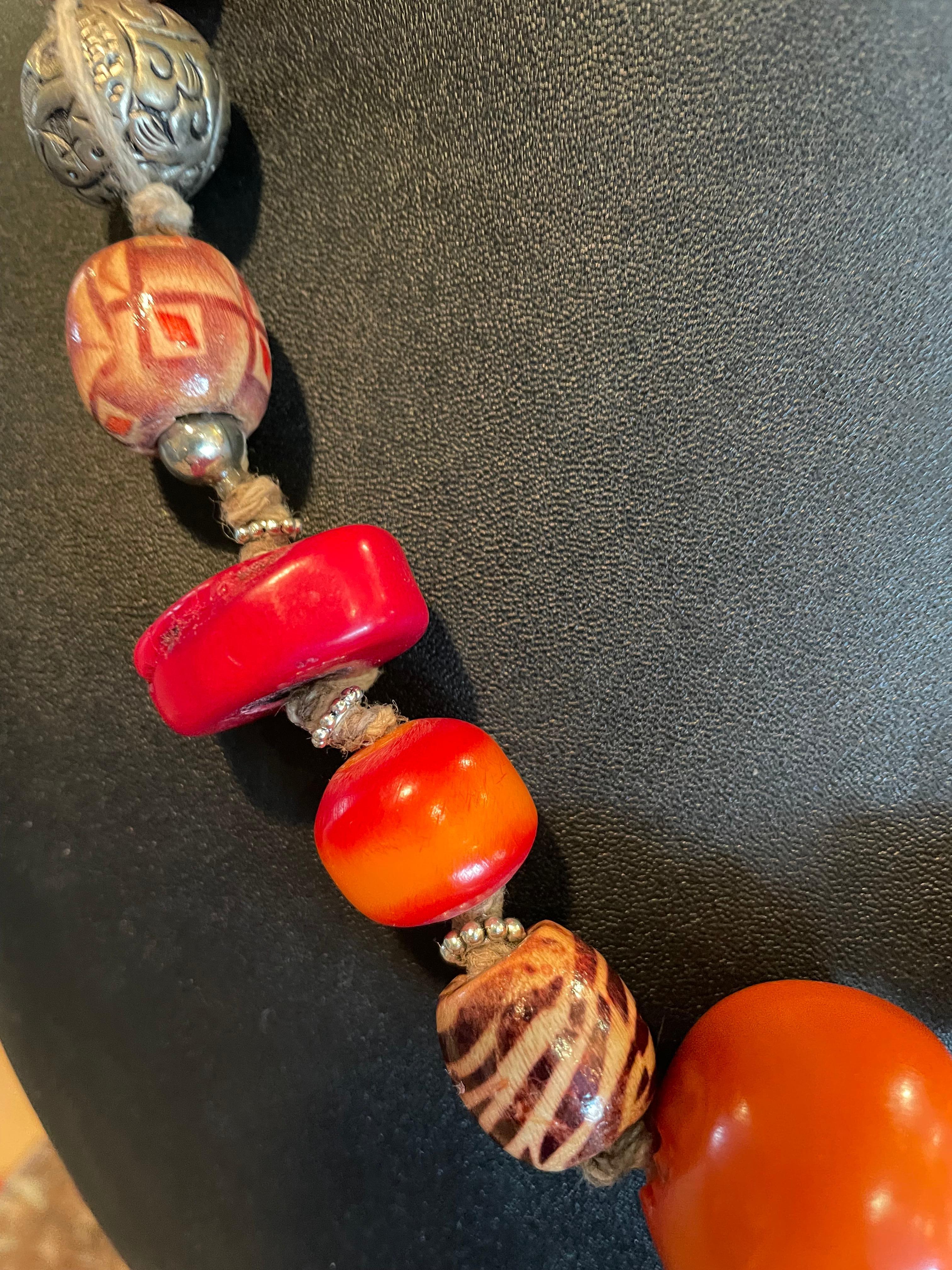 LB offers a tribal amber, coral, Tibetan silver, resin, and wood necklace In Good Condition For Sale In Pittsburgh, PA