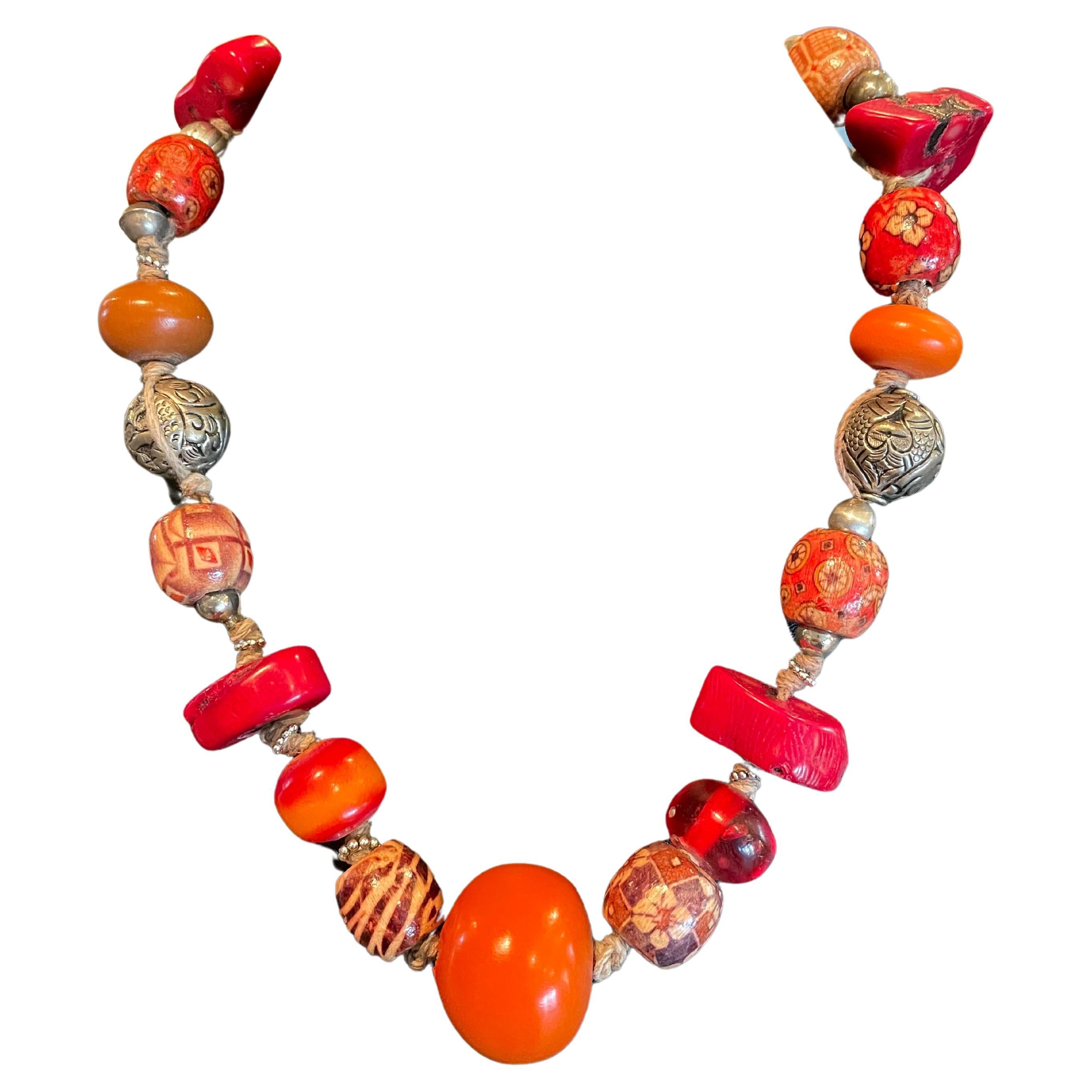 LB offers a tribal amber, coral, Tibetan silver, resin, and wood necklace For Sale