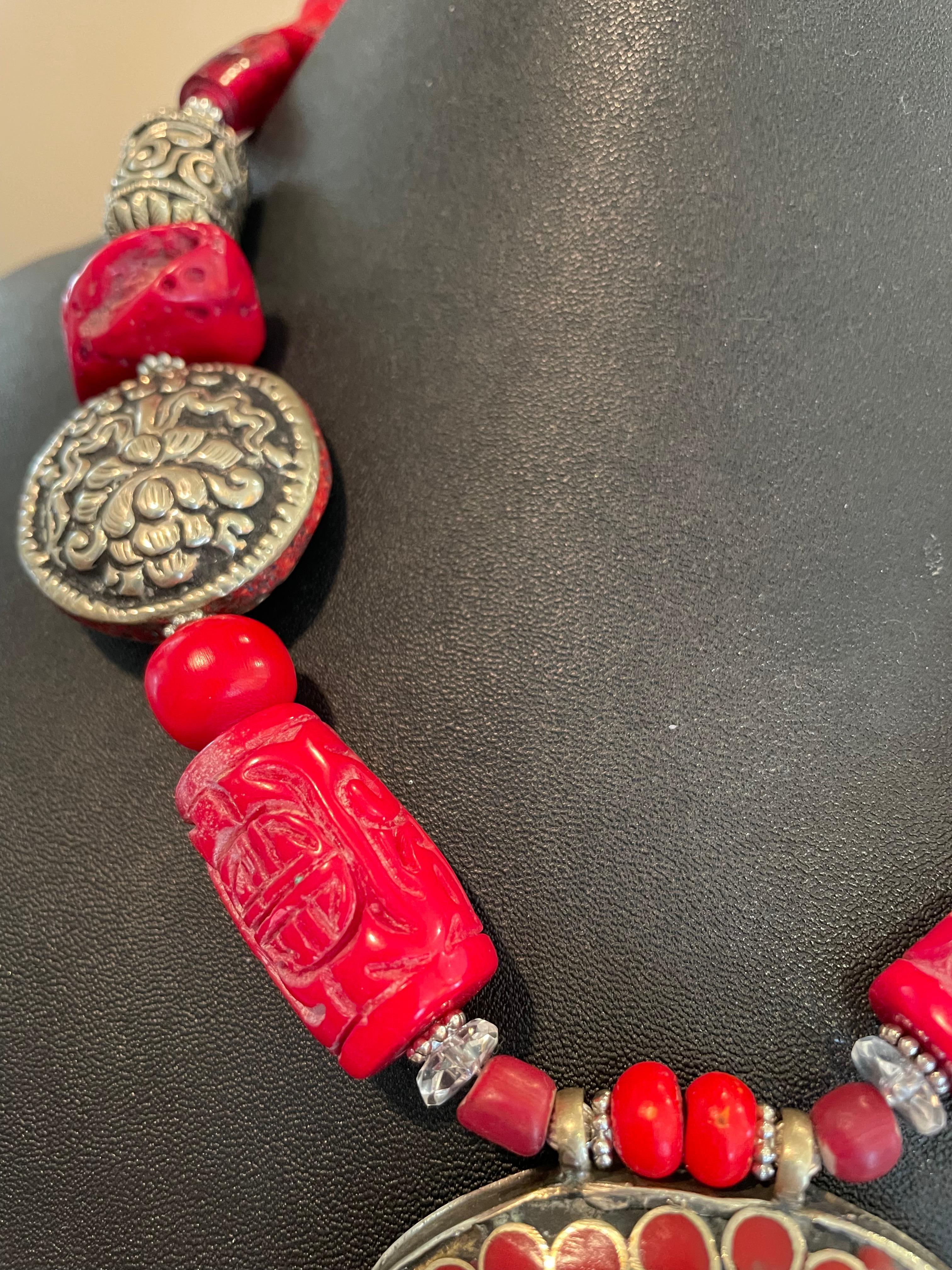 LB offers a Tribal Tibetan Coral Silver pendant Coral Glass Silver necklace In Good Condition For Sale In Pittsburgh, PA