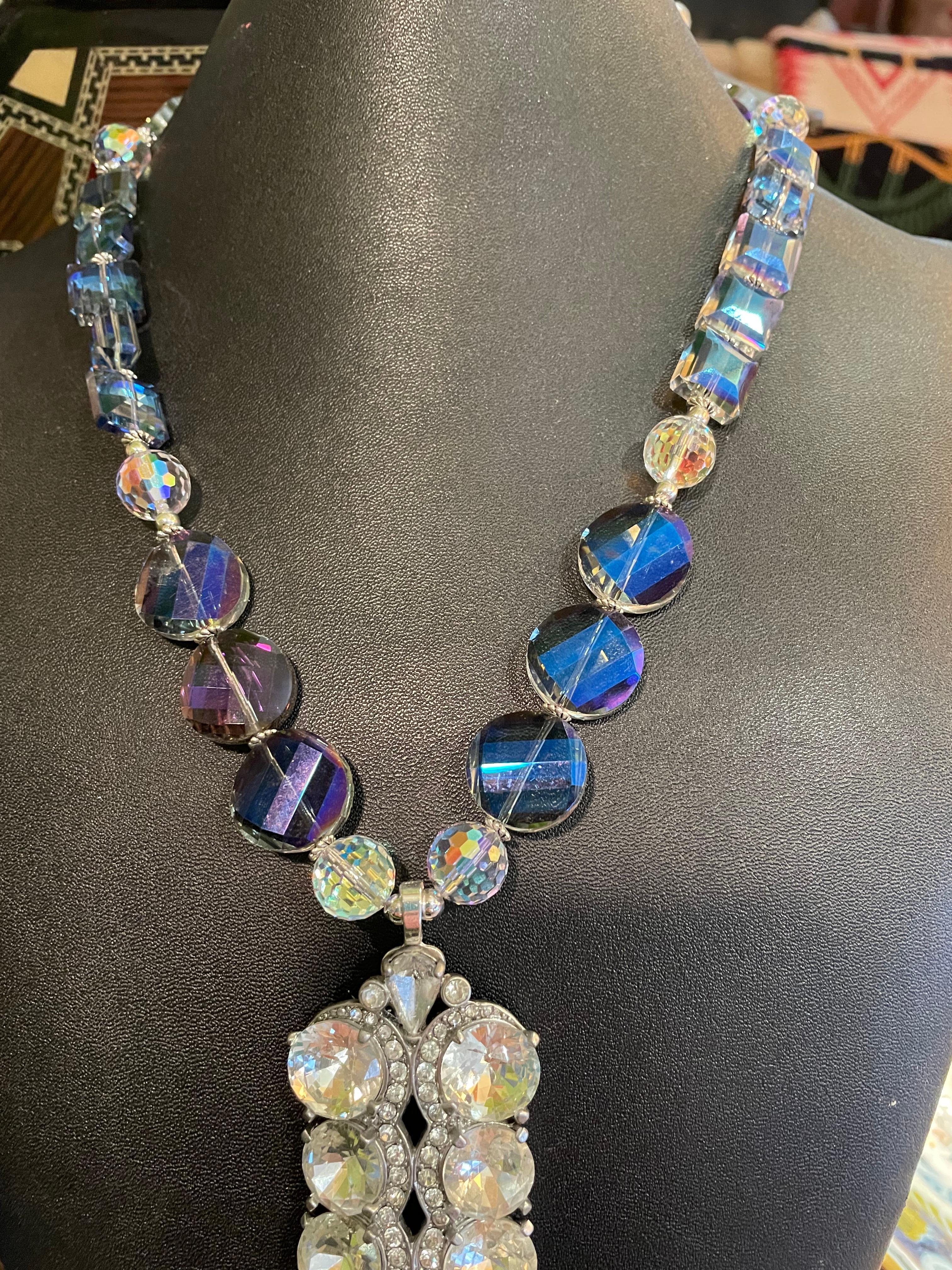 Lorraine’s Bijoux has on offer a vintage Crystal Dress clip from the 40’s with very large faceted stones. This magnificent piece is enhanced by a string of Czech faceted crystals and vintage faceted crystal beads. 
This handmade, one of a kind