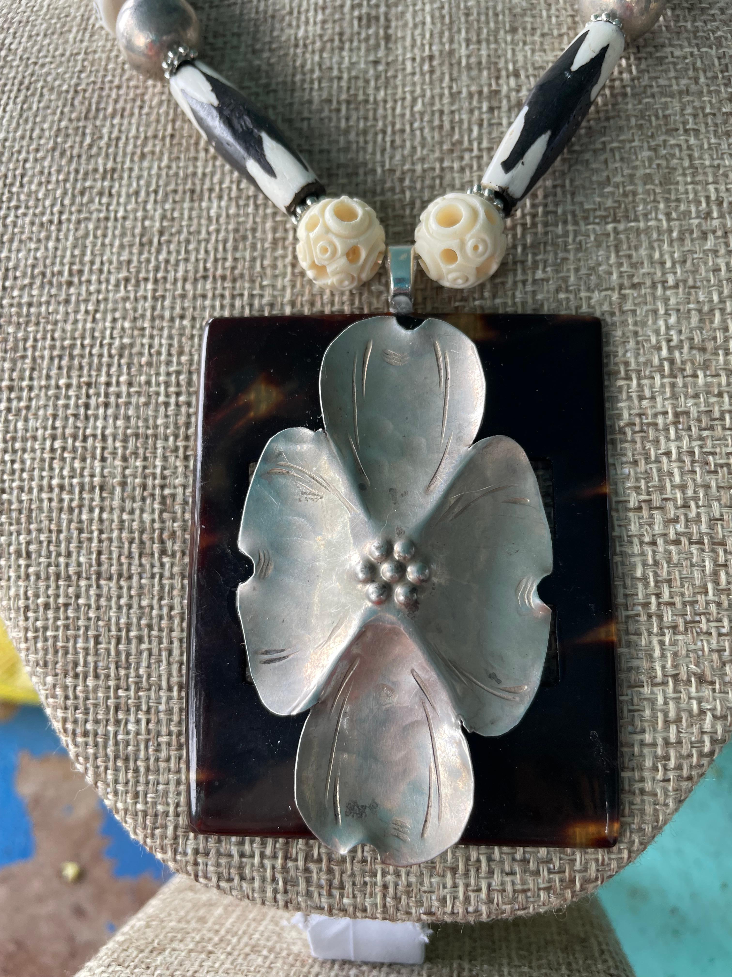 Lorraine’s Bijoux has on offer a Vintage Sterling Silver Floral Brooch and vintage Faux Tortoise Bakelite Buckle Necklace.
Vintage carved round Bone beads, African painted Ceramic tubular beads, Vintage Mexican Sterling Silver Rounds, Carved bone