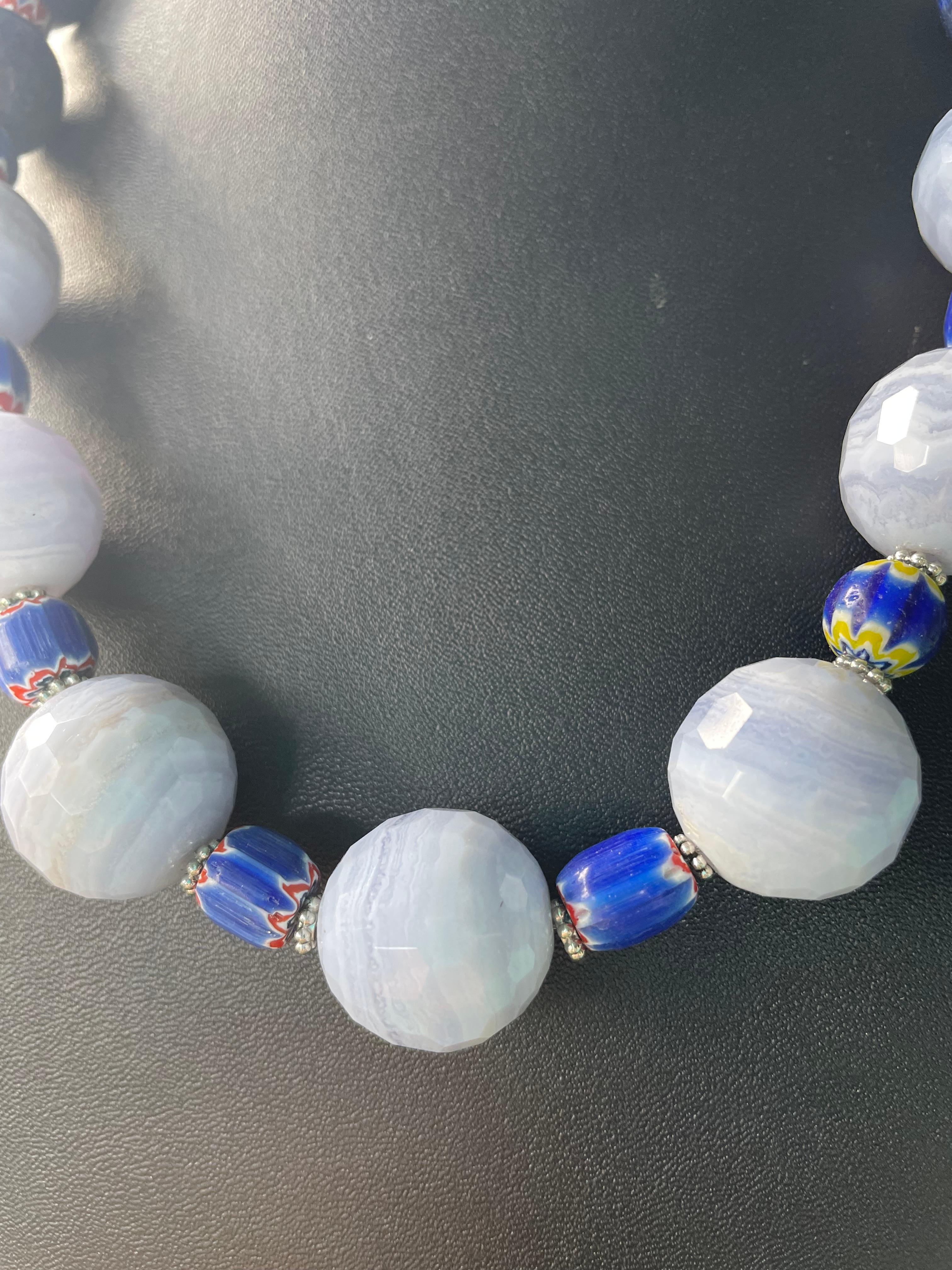 Lorraine’s Bijoux has on offer a large Chunky necklace of Blue Lace Agate and Lapis Lazuli with Vintage Venetian trade beads. The trade beads and Sterling Silver 
Rondelles act as spacers between the large beads and antique cobalt blue glass adds