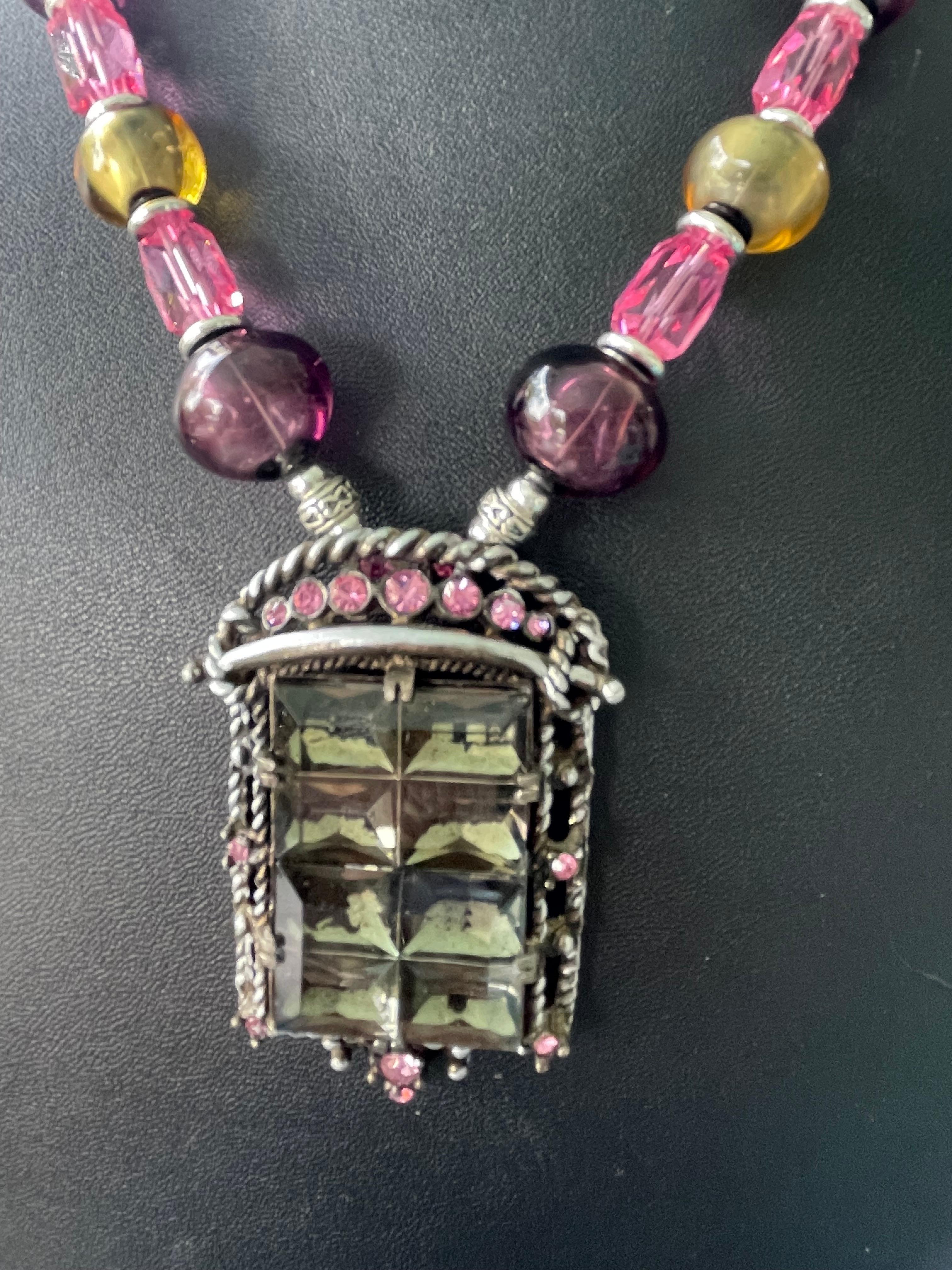 Lorraine’s Bijoux has on offer a vintage Deco cut Crystal geometric Brooch Pendant Necklace. The multi colored vintage blown glass beads enhance the rich hues of the centerpiece and highlight the  vintage pink crystal beads. ( from the 50’s) there