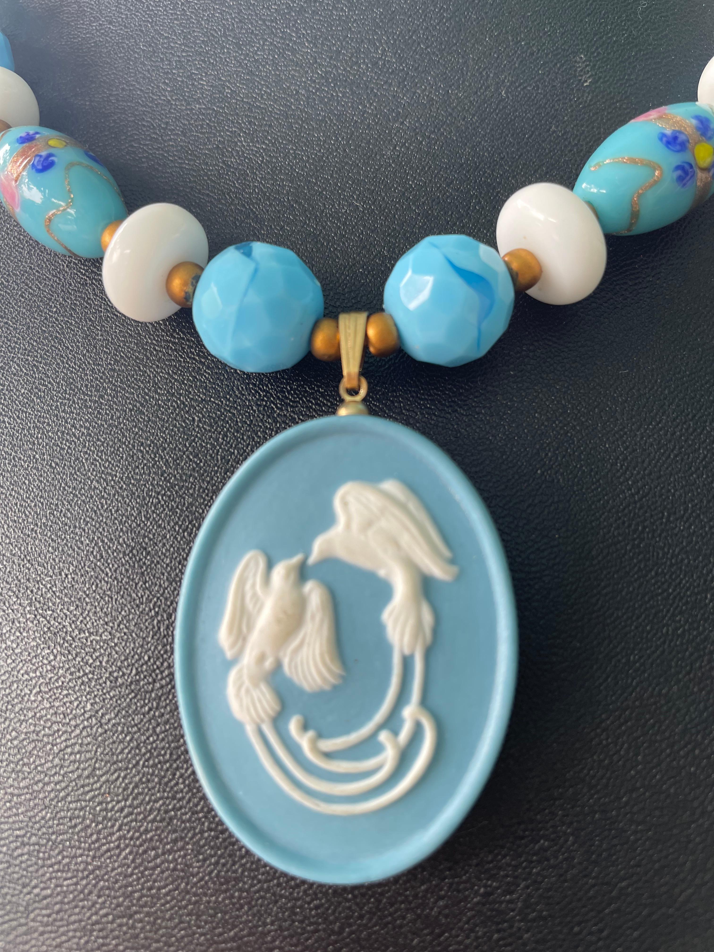 Lorraine’s Bijoux has on offer a Vintage English Blue and White Love Bird Jasperware Pendant. Vintage Wedding cake blue Venetian oval beads, smaller blue and gold Murano beads, and vintage small Venetian blue and gold beads, white glass vintage