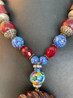 LB offers French Bakelite Carved Pendant Venetian glass Tibetan Wood necklace