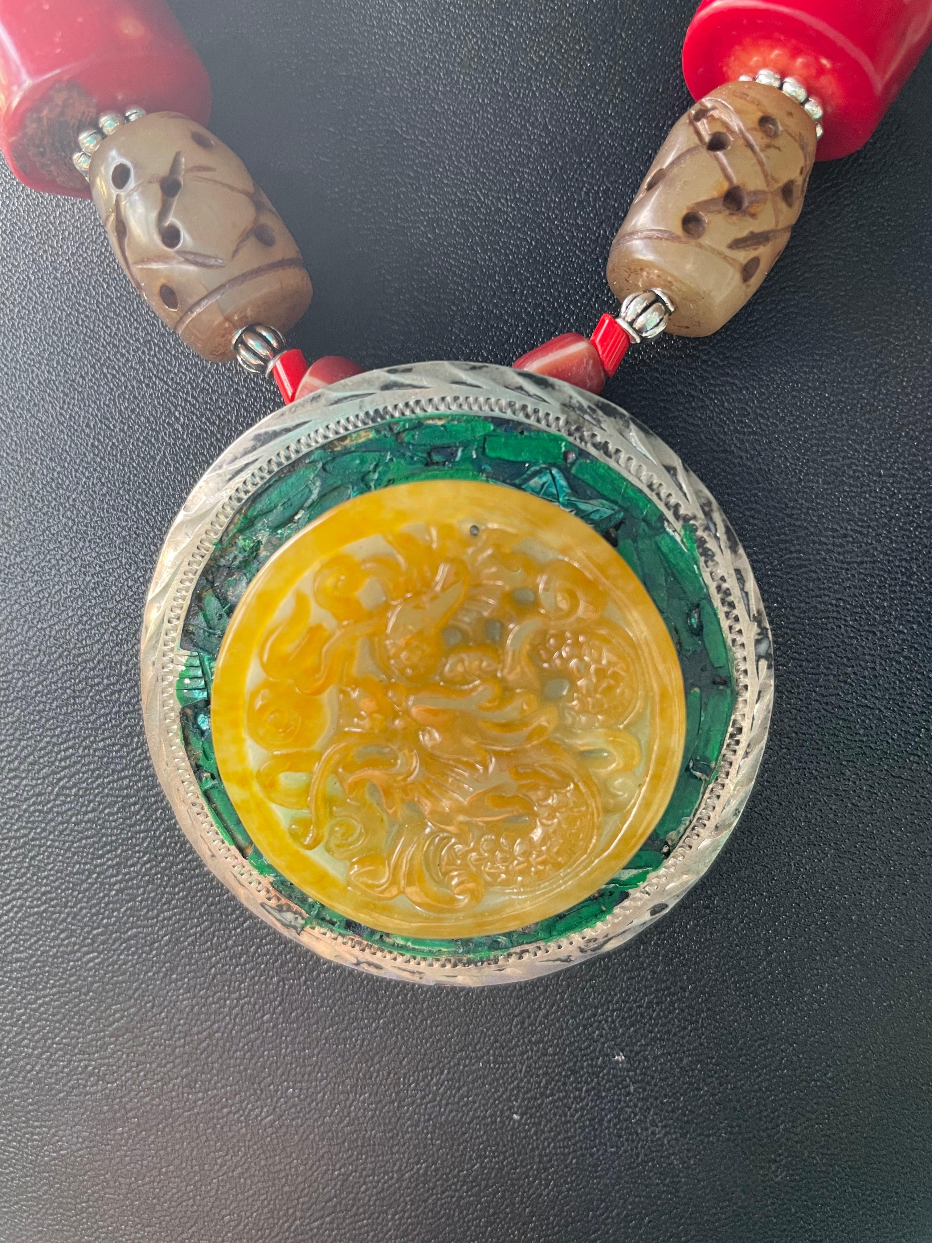 Lorraine’s Bijoux has on offer a Vintage Jade and Mexican Sterling Silver Pendant
One of a kind Statement necklace. This unusual piece combines Chinese Red Coral,
Vintage Venetian glass trade beads, Carved soapstone Chinese barrel beads, and