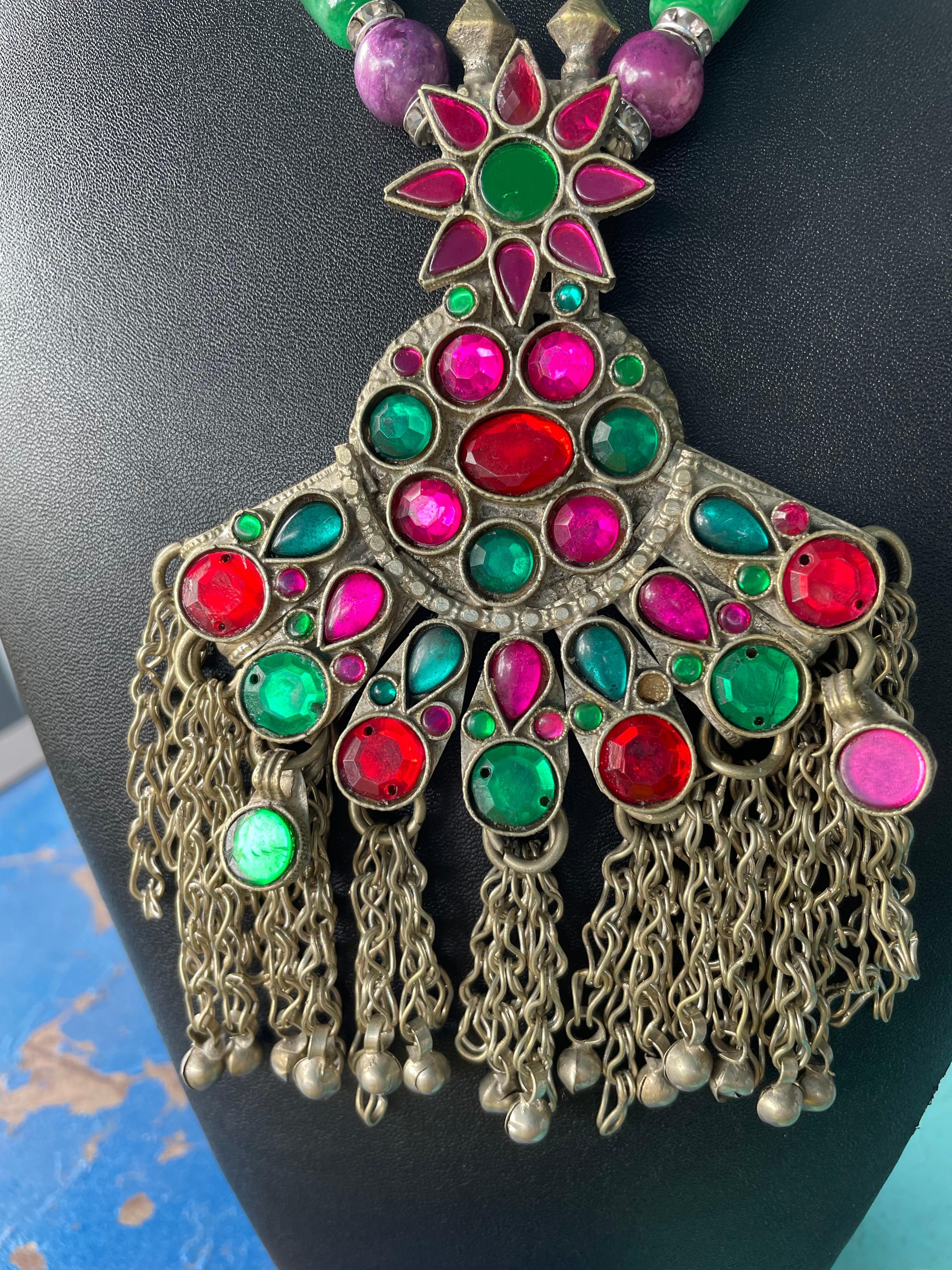 Lorraine’s Bijoux has on offer a Very Large Afghani Silver and Glass, multicolored Glass Gems, and Silver chain Dangles Pendant.
Large Green Agate tubular beads, crystal rondelles, vintage pink glass beads, green Peking glass vintage beads, Indian