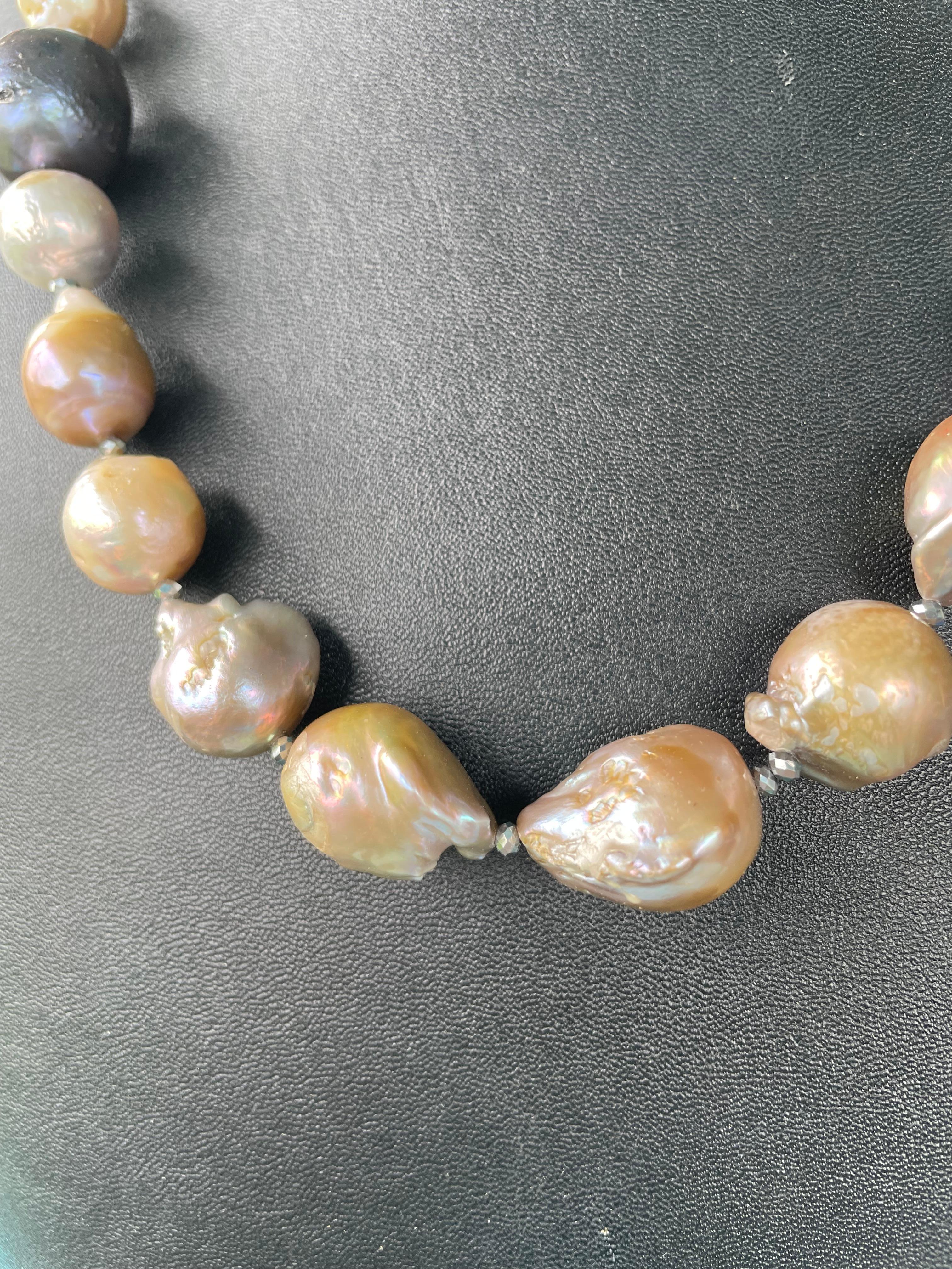 Lorraine’s Bijoux offers a Large multicolored pastel Baroque Pearl necklace. Each of these pearls is unusual and all are very different from each other. The colors vary from  peacock accent pearls to many shades of gold, tan, white, lavender, cocoa,
