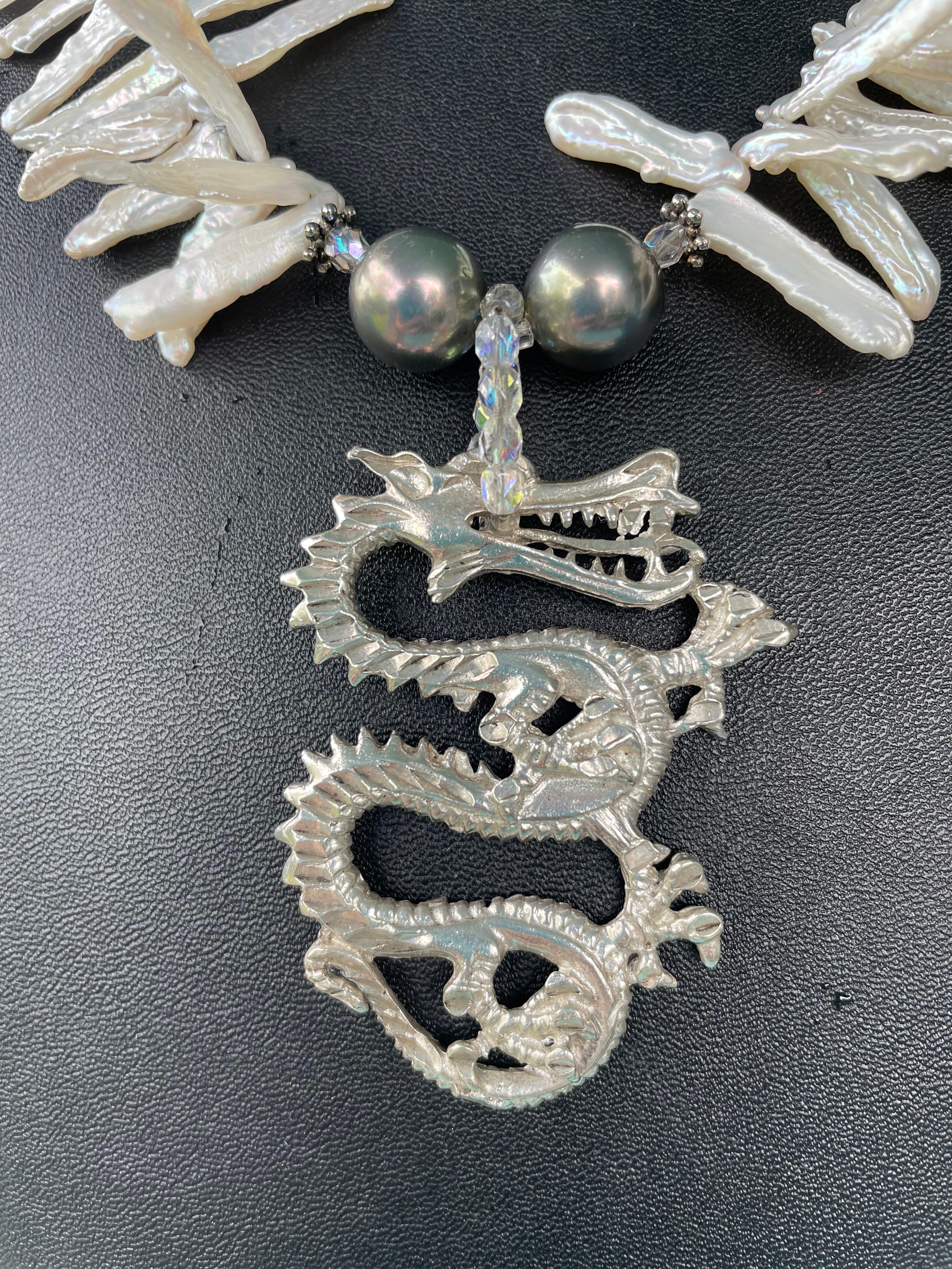 Lorraine’s Bijoux offers a One of a Kind; Vintage Sterling Silver, Chinese Dragon pendant necklace. This is a beautifully wrought Sterling pendant with outstanding detail and a lovely patina. This handmade piece features Peacock Majorcan pearls,