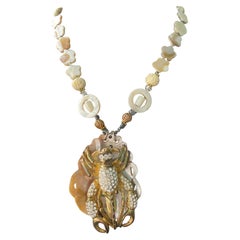 LB offers Vintage 60’s Lobster Brooch Scalloped shell MOP Carved Bone Necklace