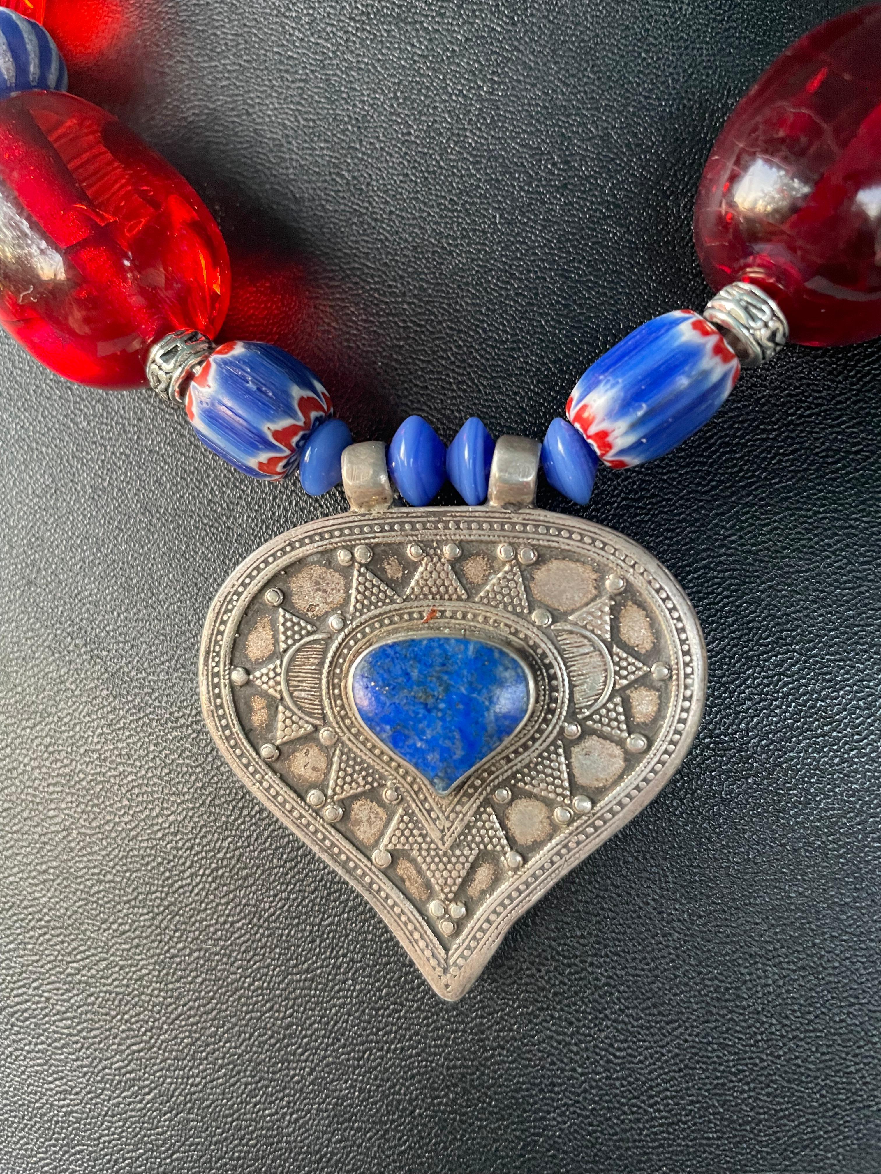 Lorraine’s Bijoux has on offer a Vintage heart shaped Sterling Silver and Lapis Lazuli pendant necklace. This piece is all handmade and simply stunning with large Red Indian resin beads,Vintage blue striped Venetian beads, and Sterling silver