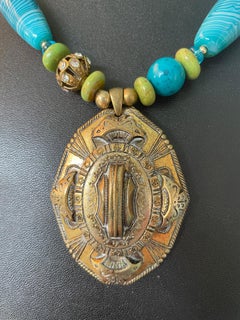 LB offers Vintage Brass Repousse pendant Agates Turquoise Glass Tibetan necklace
