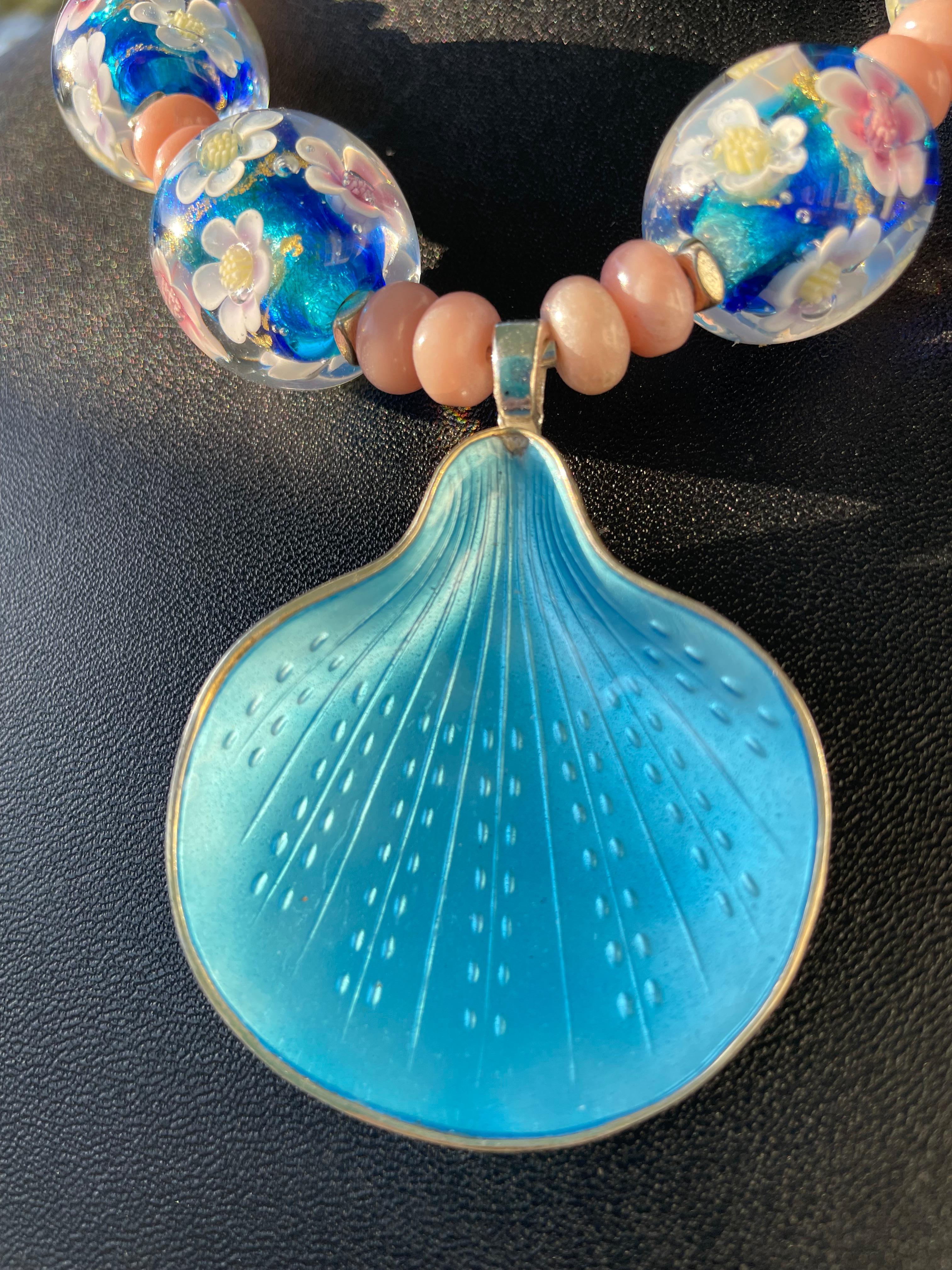Lorraine’s Bijoux offers a Vintage 50’s Danish Enamel and Sterling Silver brooch pendant Necklace. This is a stunning turquoise enamel piece that is a wonderful example of Danish craftsmanship and makes an incredible centerpiece on a gorgeous
