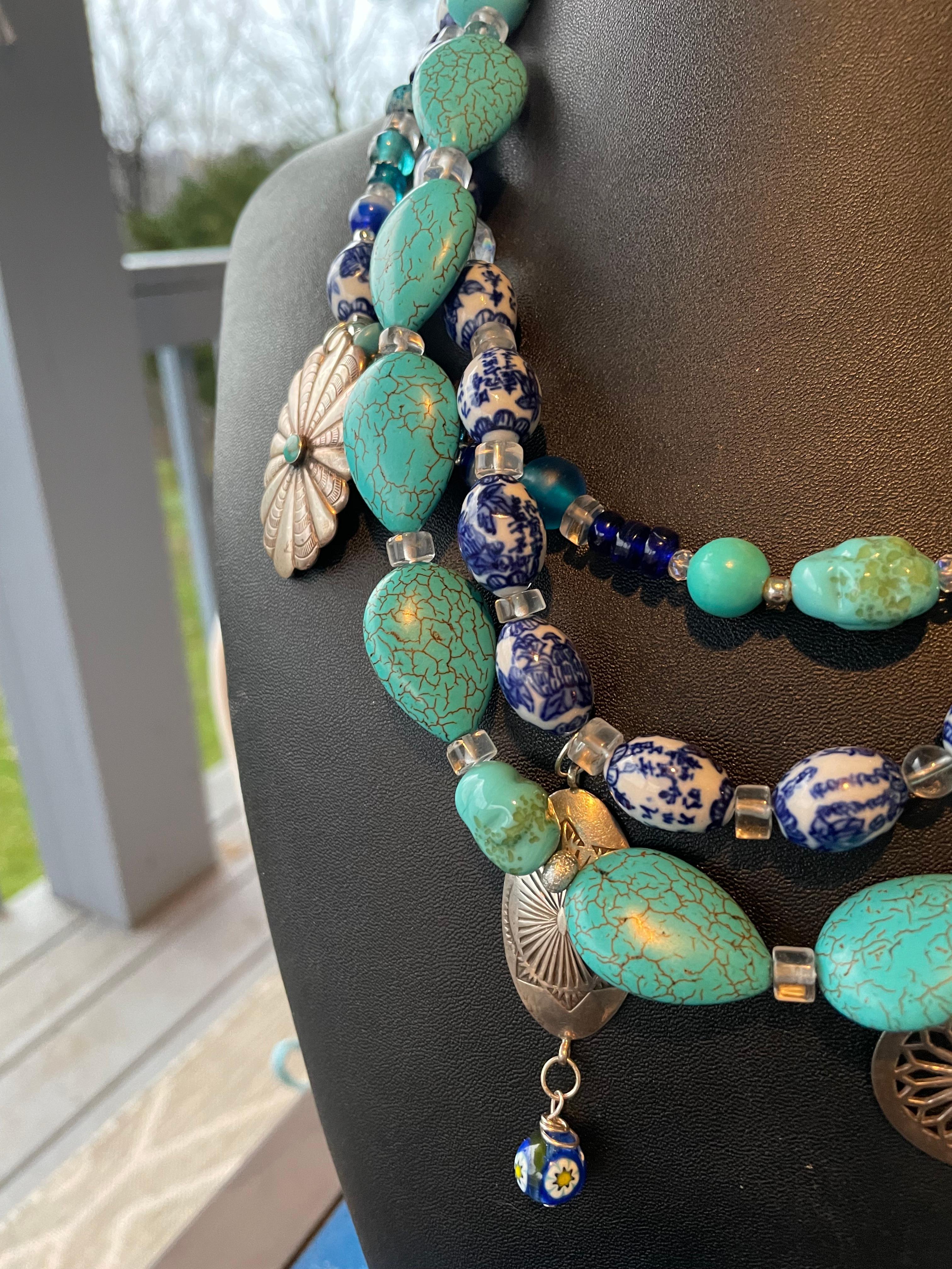 Lorraine’s Bijoux has on offer a Triple strand multi stone and Sterling Silver Vintage charms necklace. Chinese Turquoise, Vintage glass ‘Turquoise’ irregular shaped beads, Chinese blue and white character ceramic beads, Lapis lazuli, Rock crystal