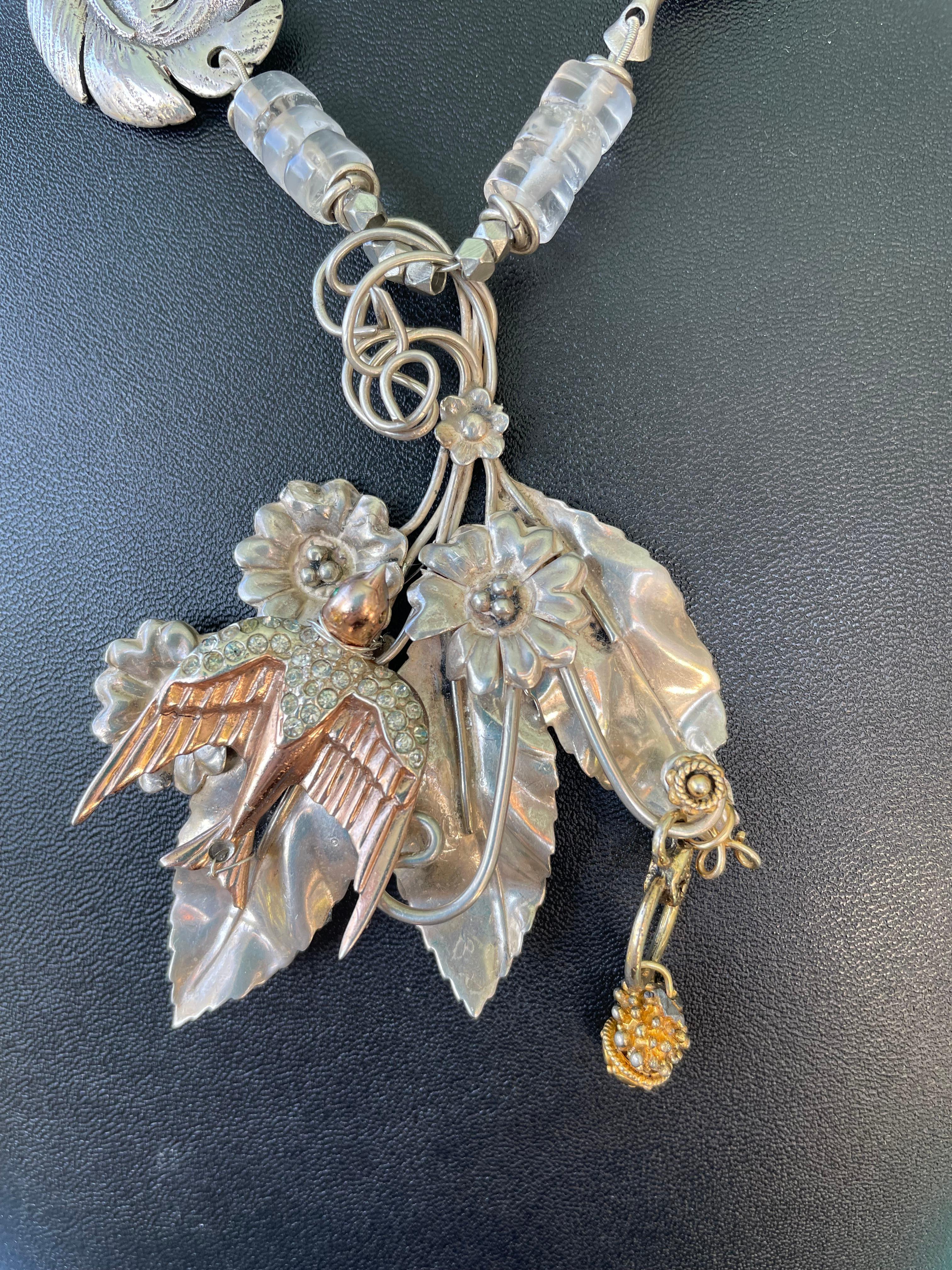 Lorraine’s Bijoux has on offer a Sterling Silver melange necklace. Handmade from Vintage Sterling Silver floral and feather brooches, this creation has added Sterling Silver Bird brooch and floral elements. This one of a kind piece is sure to stand