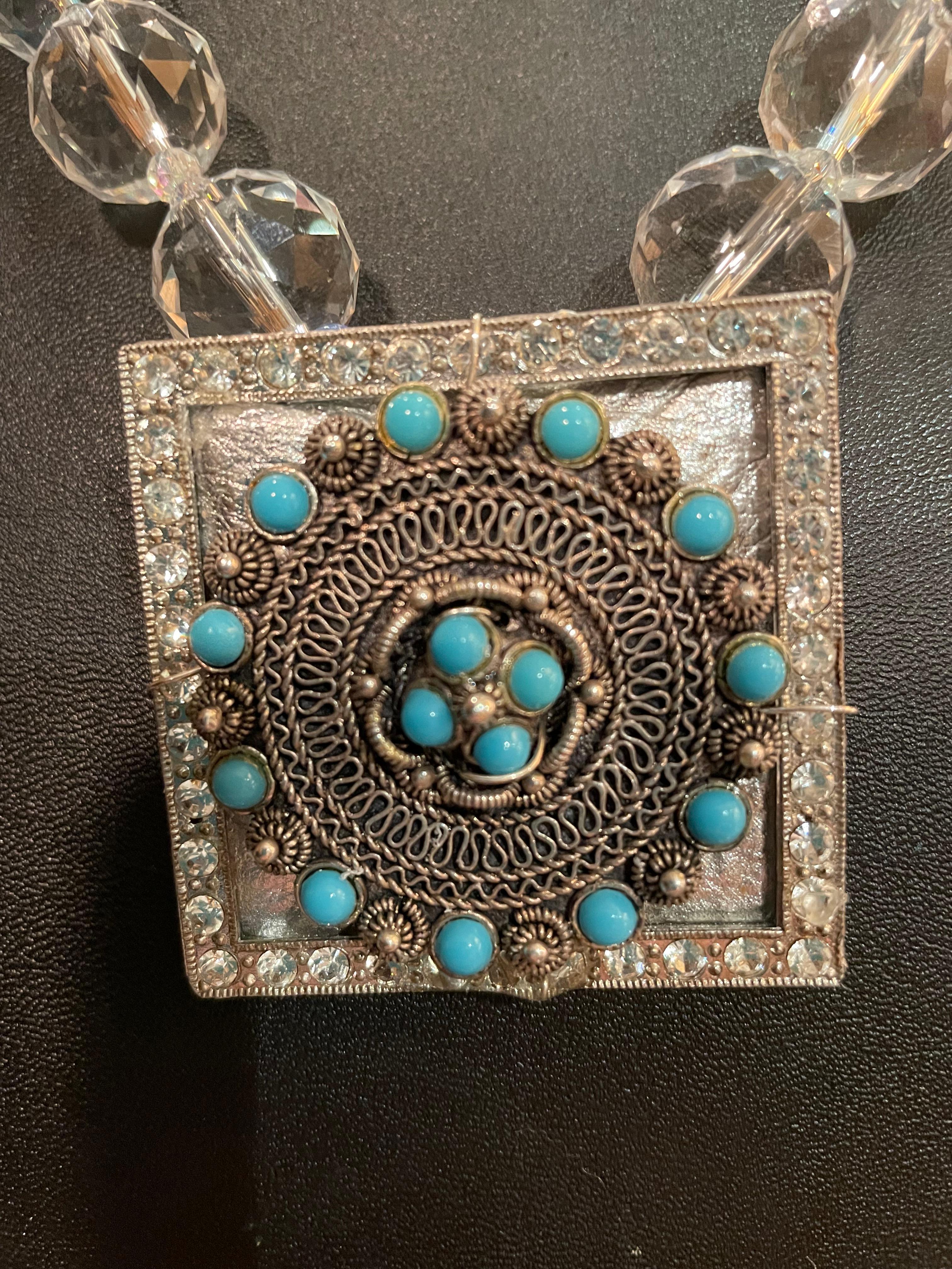 Lorraine’s Bijoux has on offer a Vintage Mexican Sterling Silver and Turquoise Brooch with a Vintage Belt Buckle and Metallic leather backing on a string of Rock Crystal faceted beads and vintage Turquoise glass beads. This is a Stunning combination