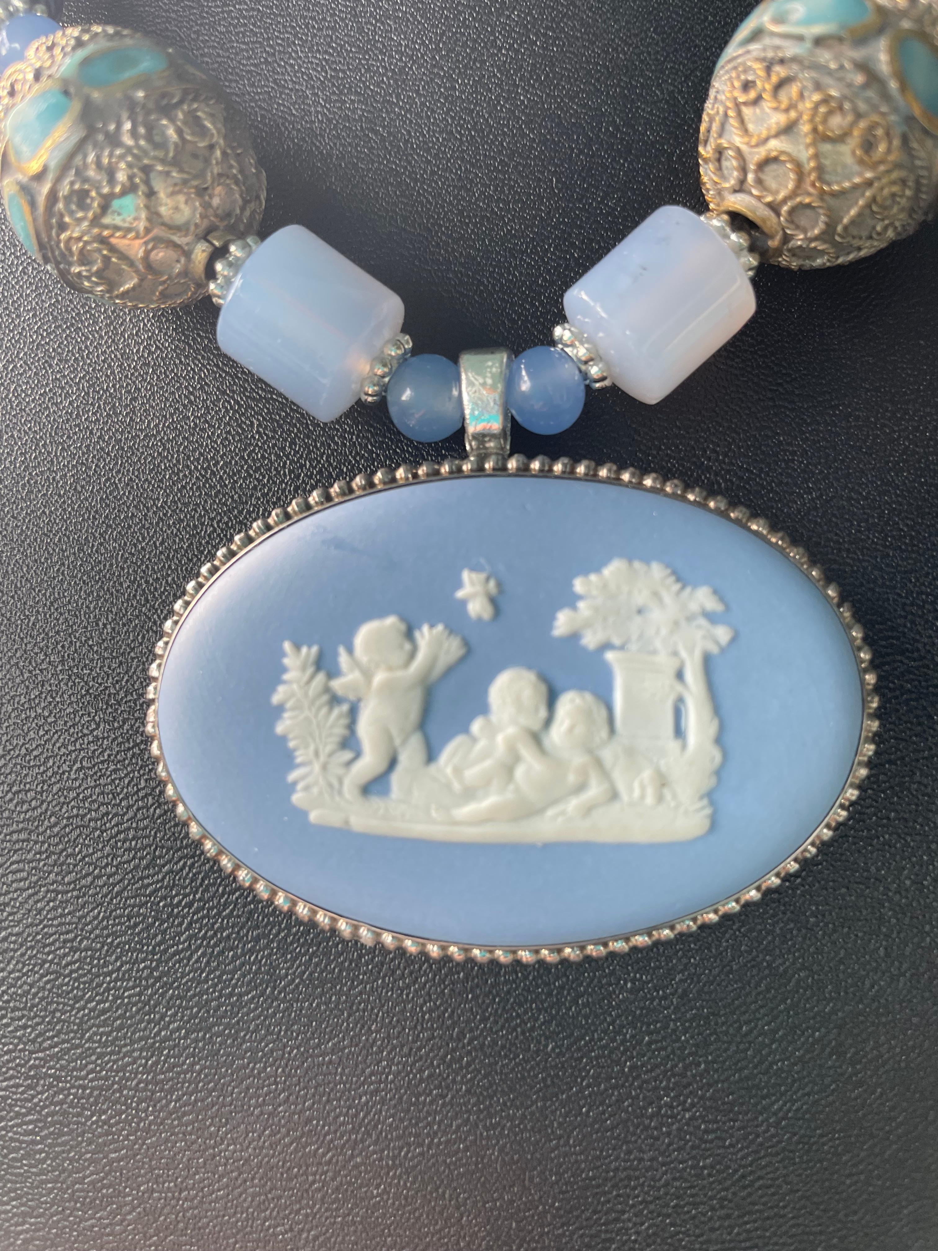 Lorraine’s Bijoux has on offer a Vintage Blue and white, Jasperware, brooch Pendant necklace. This impressive centerpiece is enhanced by large, Silver, inlaid and repousse Tibetan beads, Chalcedony, Blue and white Delft saucers, Lapis Lazuli,