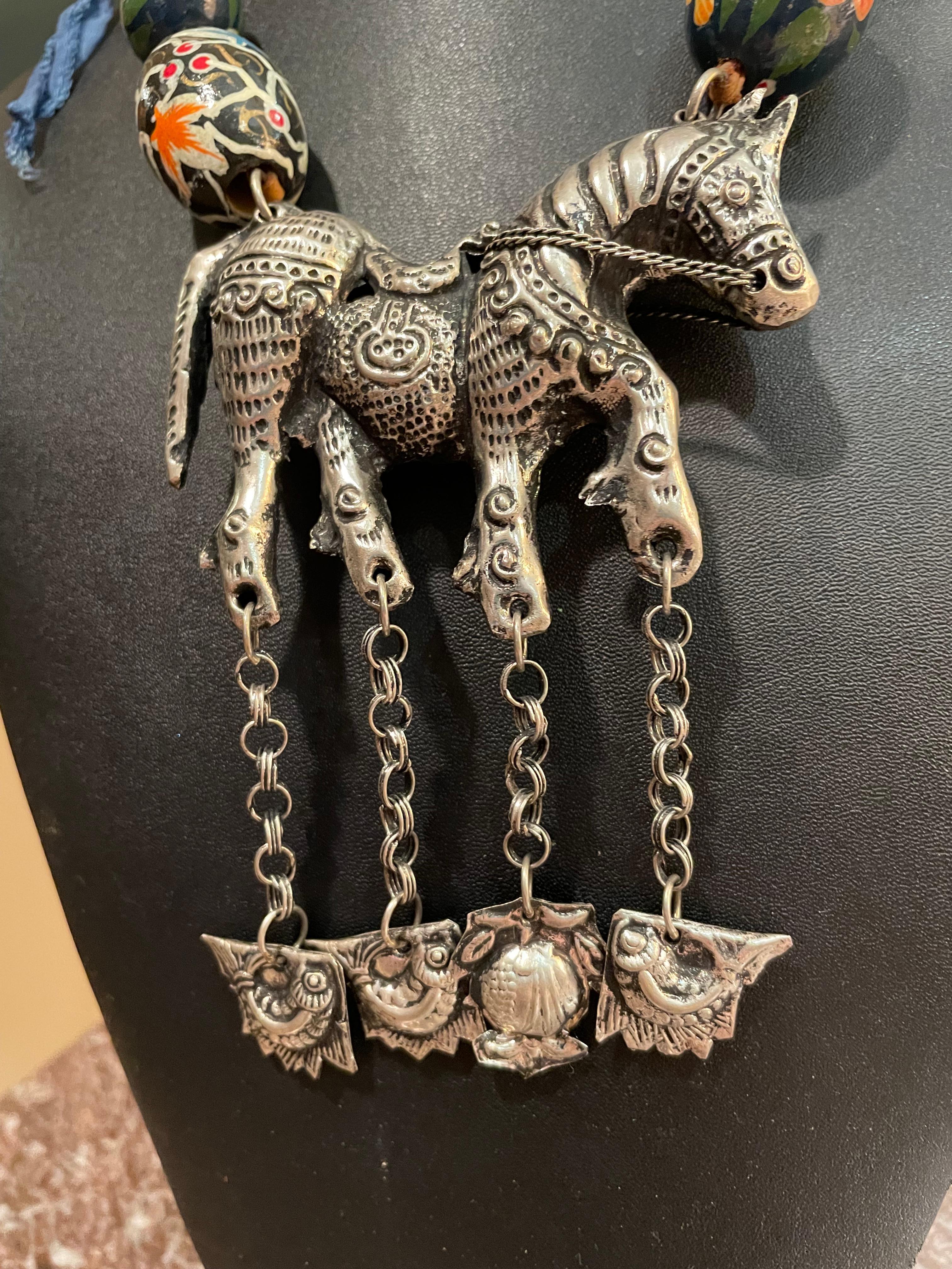 I offer a one of a kind, handmade, stunning Silver Tibetan horse pendant necklace. This piece is a direct replica of an ancient Tibetan piece with hanging cloud pendants!  The horse is a strong spiritual symbol in Tibetan culture. He represents the