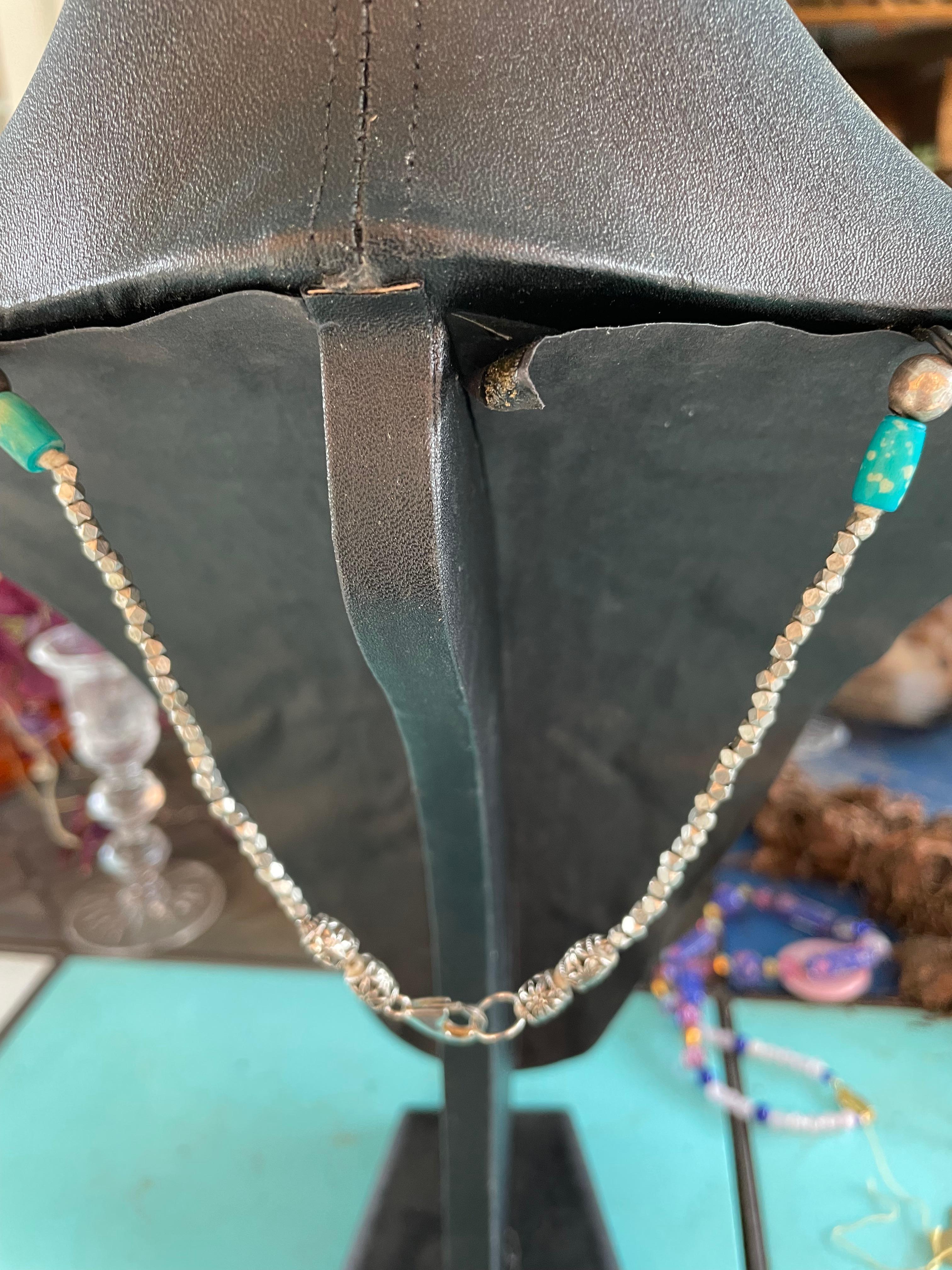 LB has on offer a vintage sterling Silver Navajo collar ornament necklace with vintage Ceramic  
Turquoise beads and sterling beads. This one of a kind, handmade, statement necklace  is dramatic and eye catching. I found the amazing vintage sterling