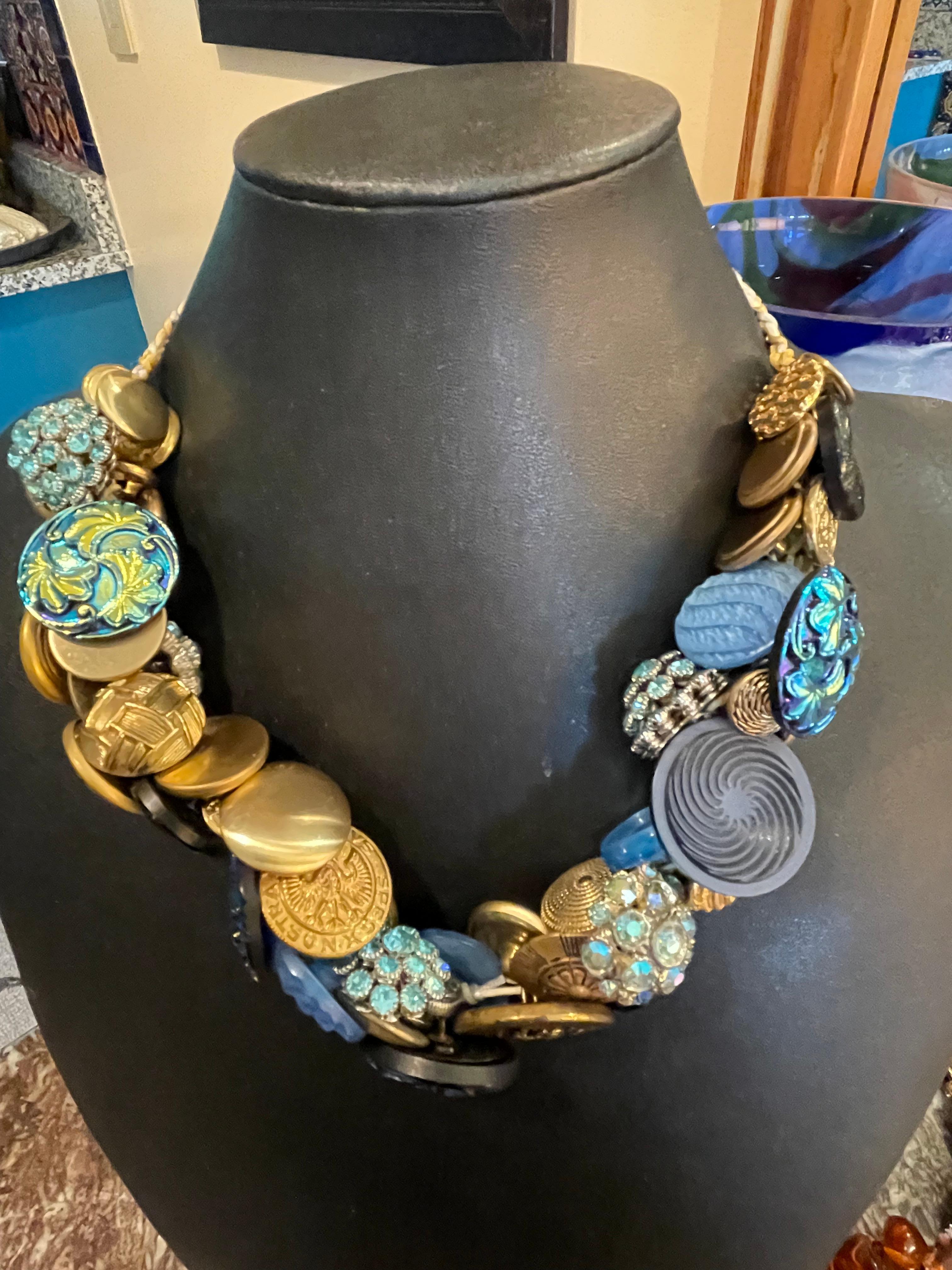 Lorraine’s Bijoux offers a Stunning Antique Czech Glass and Brass Buttons creation on a three dimensional, Adjustable necklace. This one of a kind,  Handmade, totally unique piece is a stunning and very unusual addition to any wardrobe. The amazing