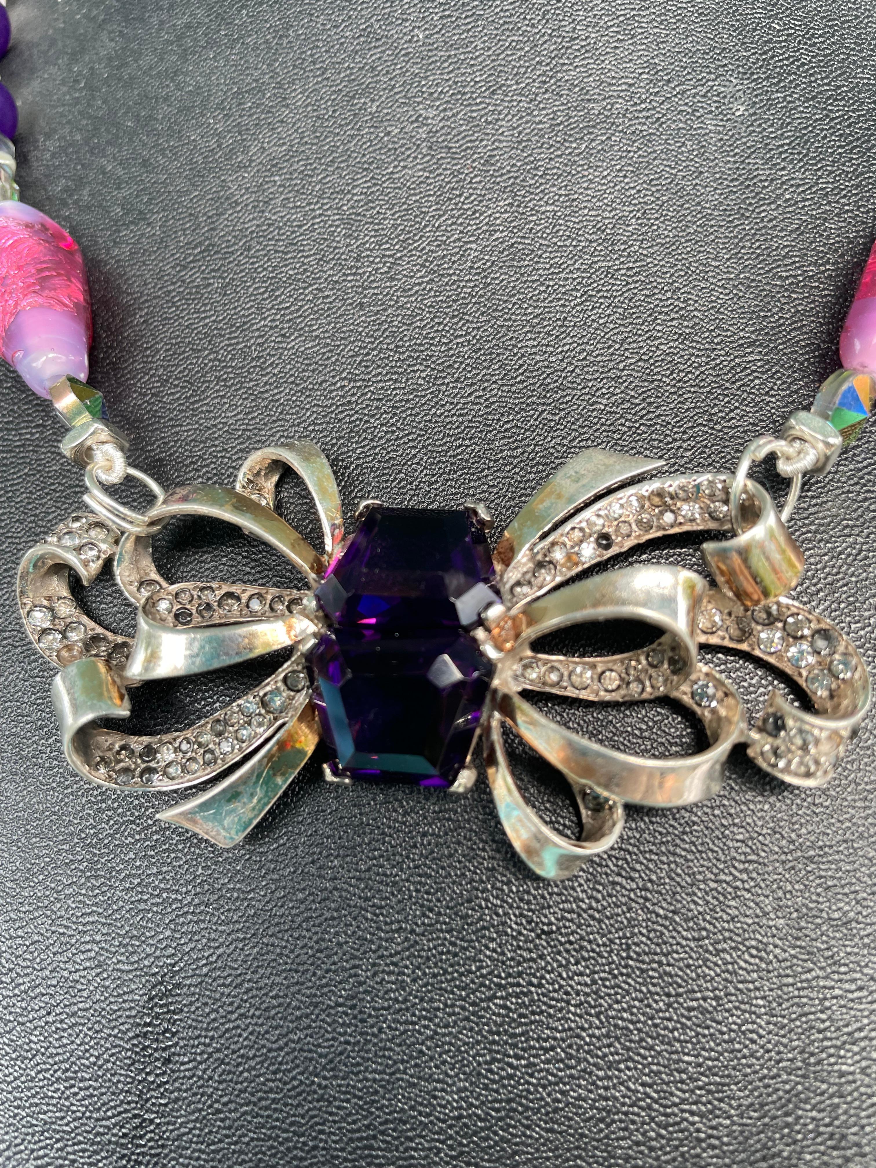 Lorraine’s Bijoux Vintage Sterling Silver Art Nouveau Bow brooch , one of a kind, handmade necklace is on offer. This vintage, elegant, feminine, bow brooch is enhanced with marcasite and two large emerald cut glass amethyst stones that sparkle and