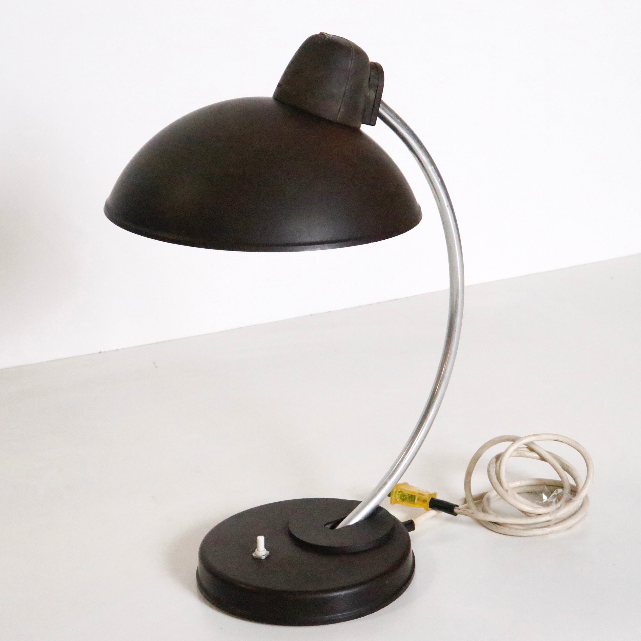 An all original brown desk lamp designed by Marianne Brandt and Hin Bredendieck for LBL, a German lamp company notable for producing Bauhaus period lighting. 

Model 0342.

Germany, circa 1930-1940. 

Signed on shade.

A dark brown adjustable shade