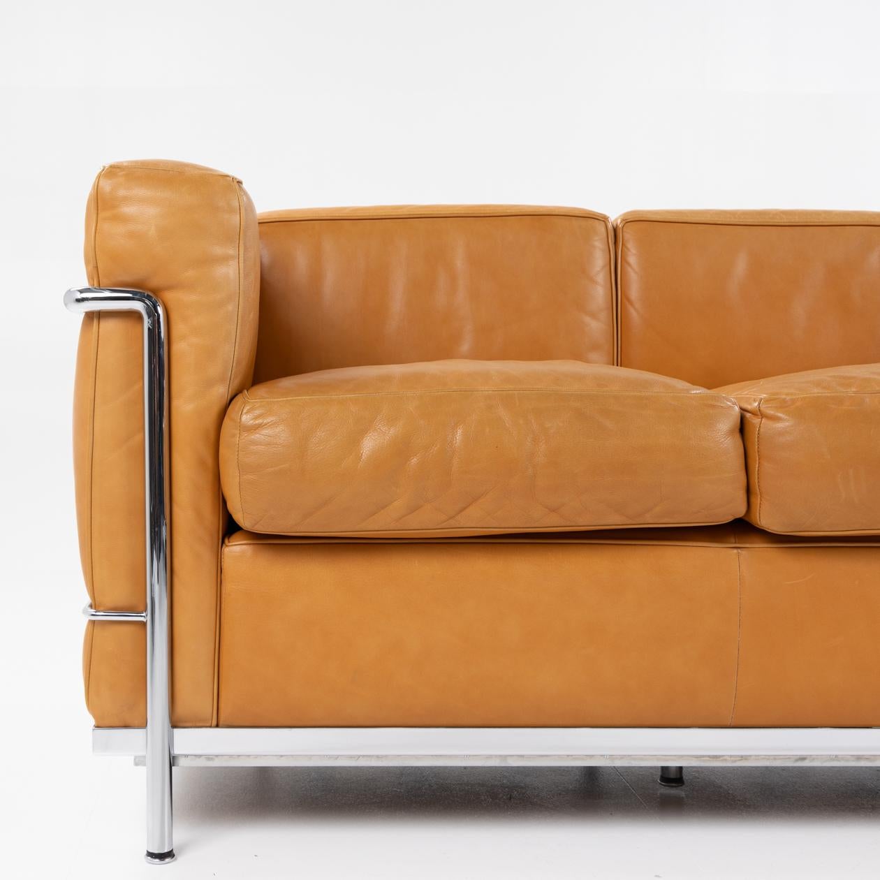 Patinated LC 3 three seater sofa by Le Corbusier