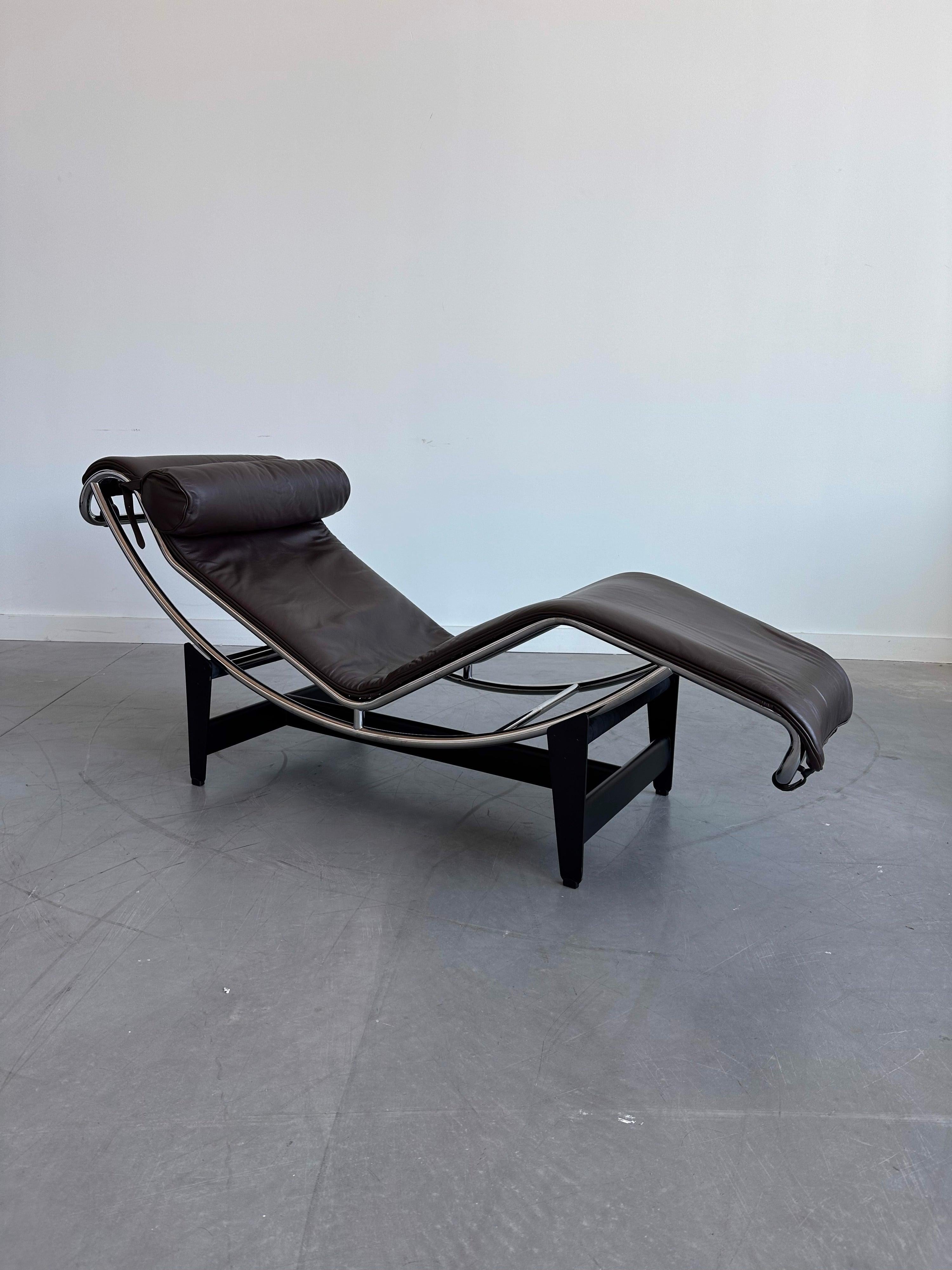 Iconic LC 4 Lounge Chair By Le Corbusier For Cassina in Dark Brown Leather. Impressed mark 'LC4' to chrome frame and 'Cassina' mark to steel base. Made in Italy.
