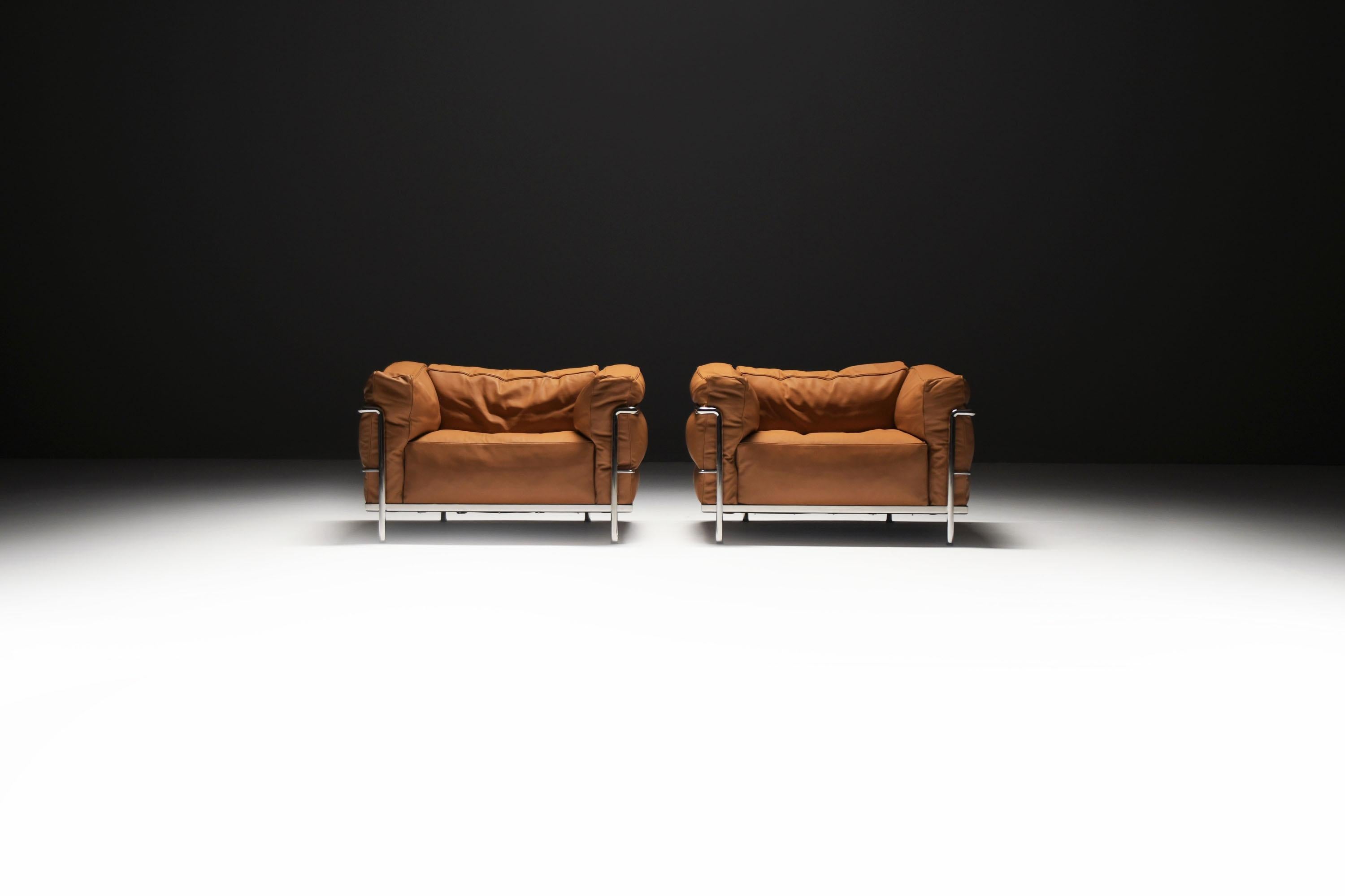 These stylish lounge chairs exude timeless comfort and elegance. Offering more relaxation than the smaller LC2 version, they feature down-filled cushions wrapped in thick, soft cognac leather. This combination gives them a sexy, nonchalant look,