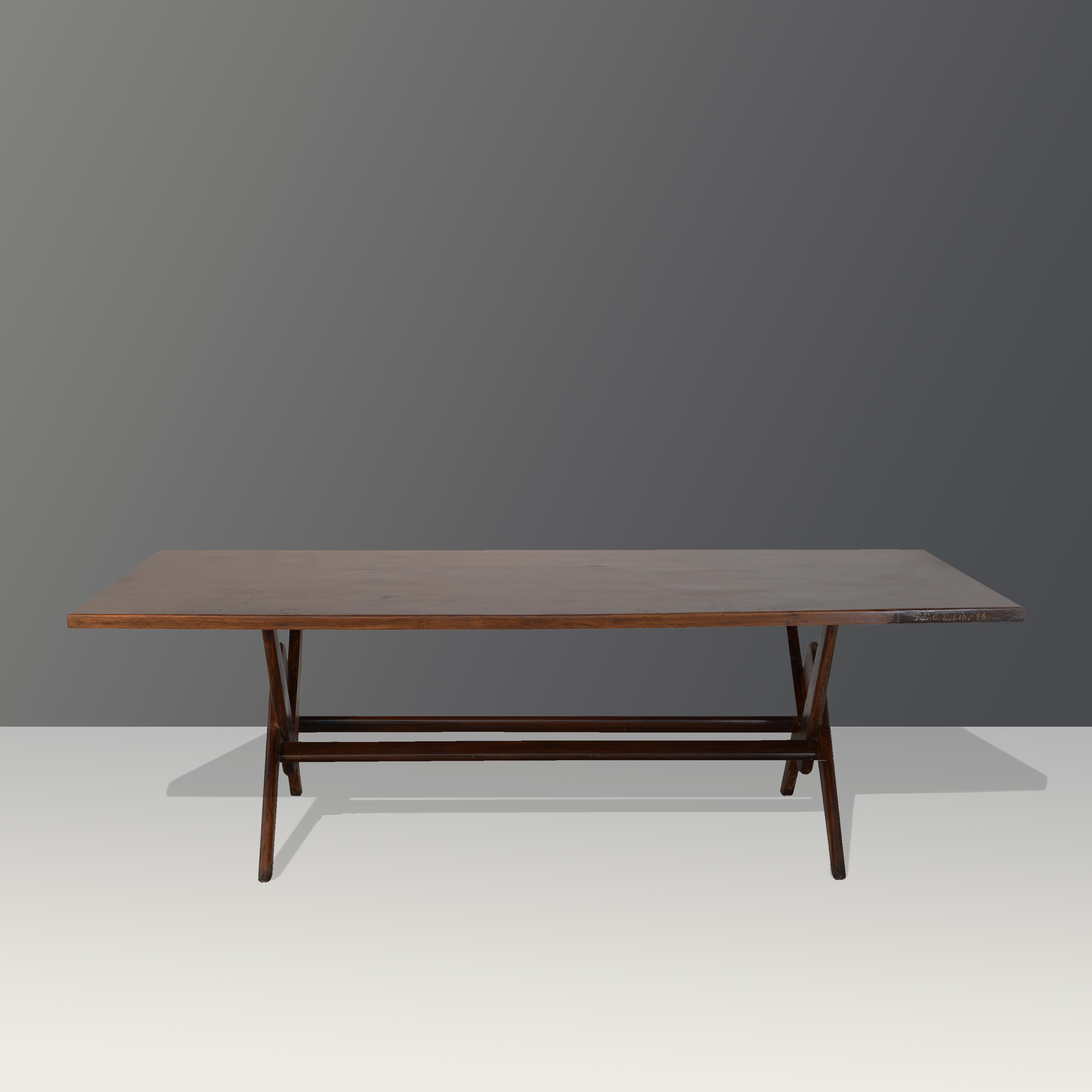 This table is an iconic design piece created by Le Corbusier and Pierre Jeanneret. It is raw in its simplicity and it shows a slightly patinated material. It's shape is beautifully fragile and has a wonderful color. We don't restore them too much.