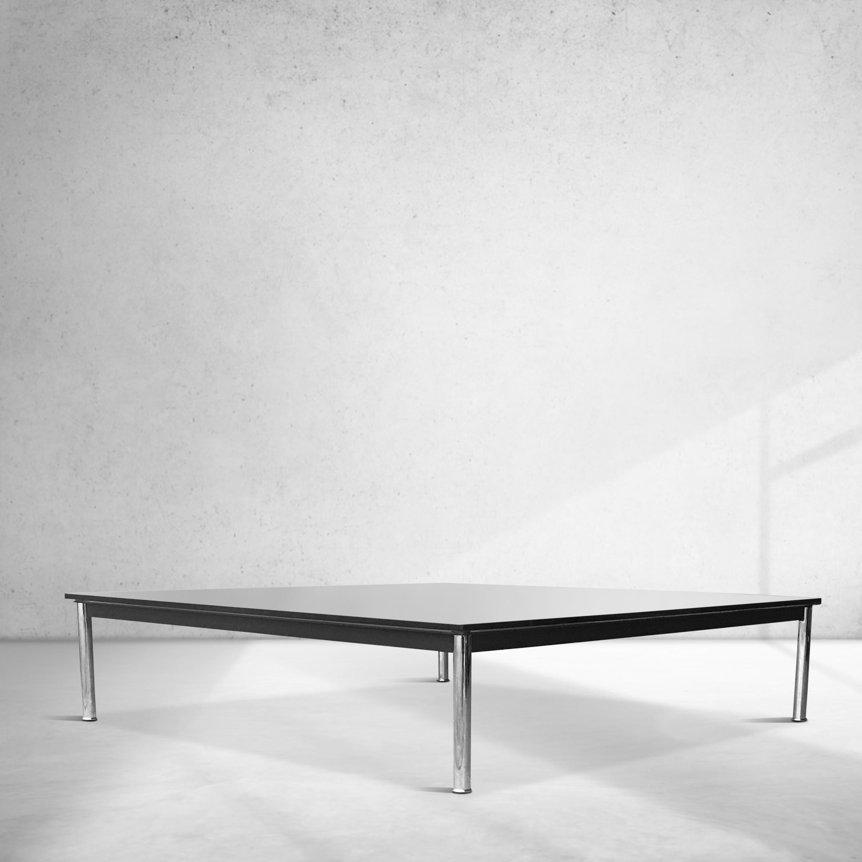 Classic LC10 coffee table by Le Corbusier, Pierre Jeanneret and Charlotte Perriand for Cassina.

1990s production, with original markings on the side of the frame, in the largest 140  x 140 variant.

Original purchase invoice comes with the table.
